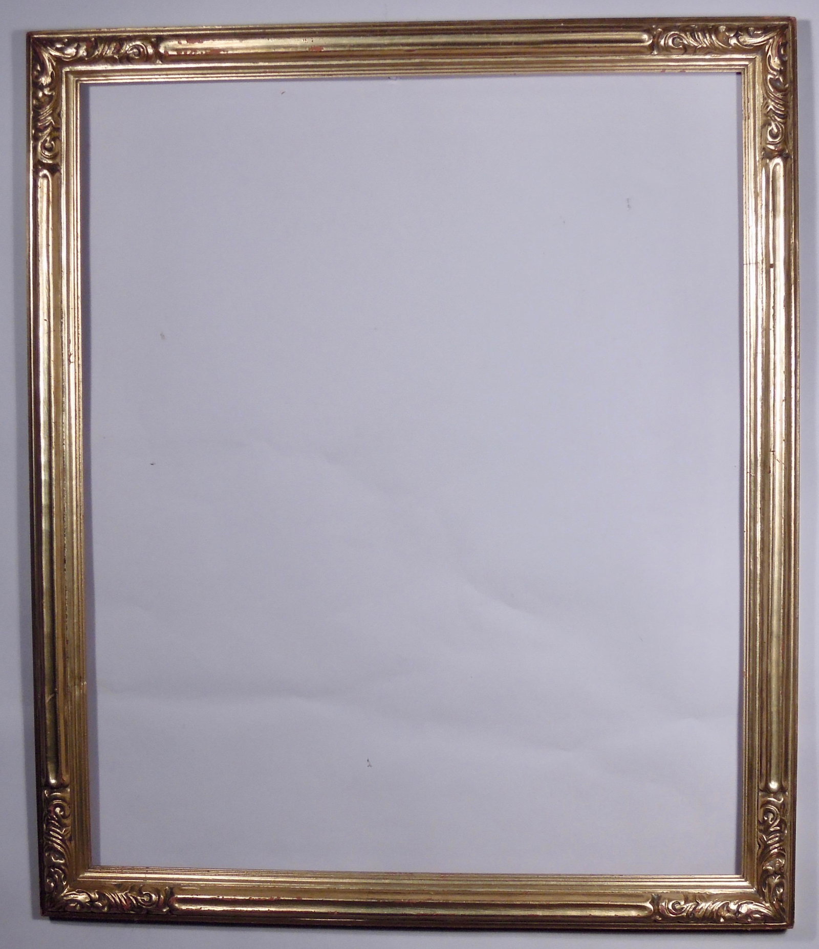Newcomb Macklin Gilt Frame: Newcomb Macklin, ca. 1920, hand carved and gilded in a standard size. Rabbet: 25" x 30" Overall Dimensions: 28 1/2" x 33 1/2" Molding Width: 2"