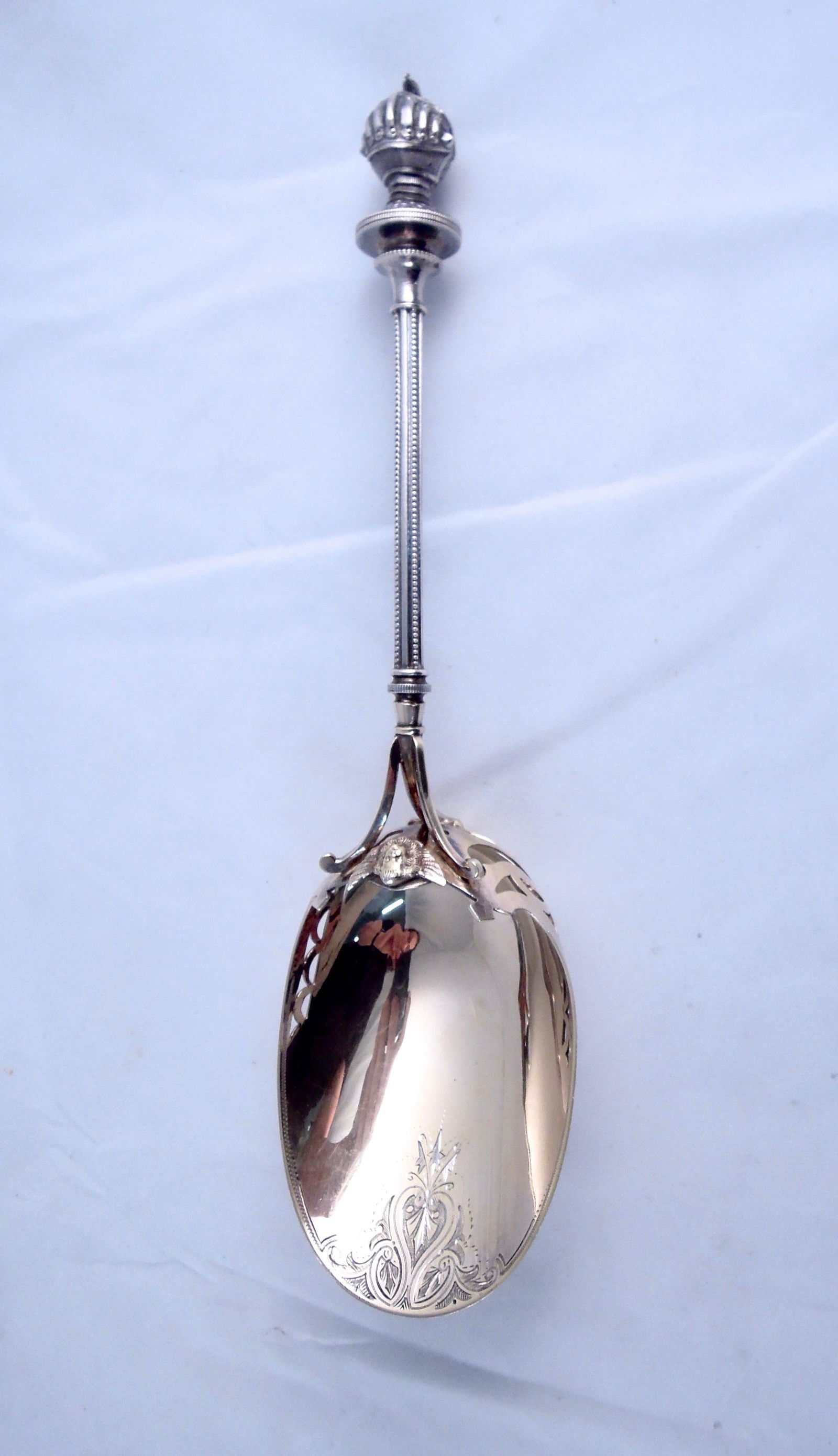 George Sharp Sterling Figural Nut Scoop: Full 3 Dimensional Knights Helmet, topped with a mouse. Applied angel at top of pierced and gilded scoop. Smart engraving. Hallmarked as shown. 10 1/2". 4.48 troy.