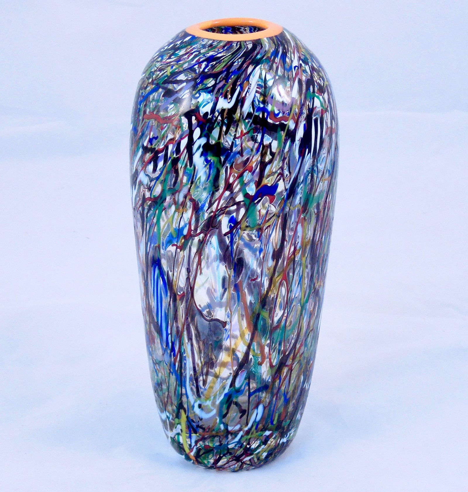 Bertil Vallien for Kosta Boda Art Glass Vase: Whiplash coloring , vibrant orange neck. Signed B. Vallien. label on side. 10" tall.