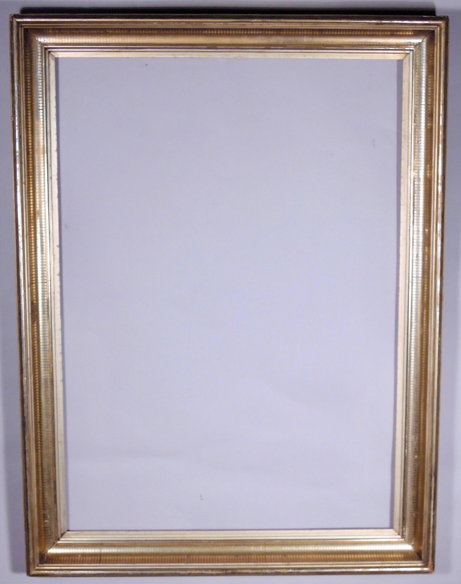 Lemon Gold Gilt Stenciled Cove Frame: American, ca. 1860, bright gilt cove with stenciled fluting. Rabbet: 20" x 28" Overall Dimensions: 24" x 32" Molding Width: 2 1/2"