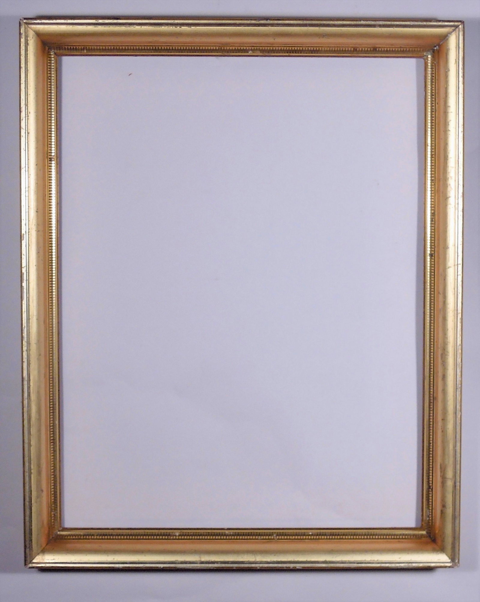 Lemon Gold Gilt Stenciled Cove Frame: American, ca. 1860, bright gilt cove with stenciled fluting. Rabbet: 16" x 20 1/2" Overall Dimensions: 18 1/2" x 23" Molding Width: 1 1/2"