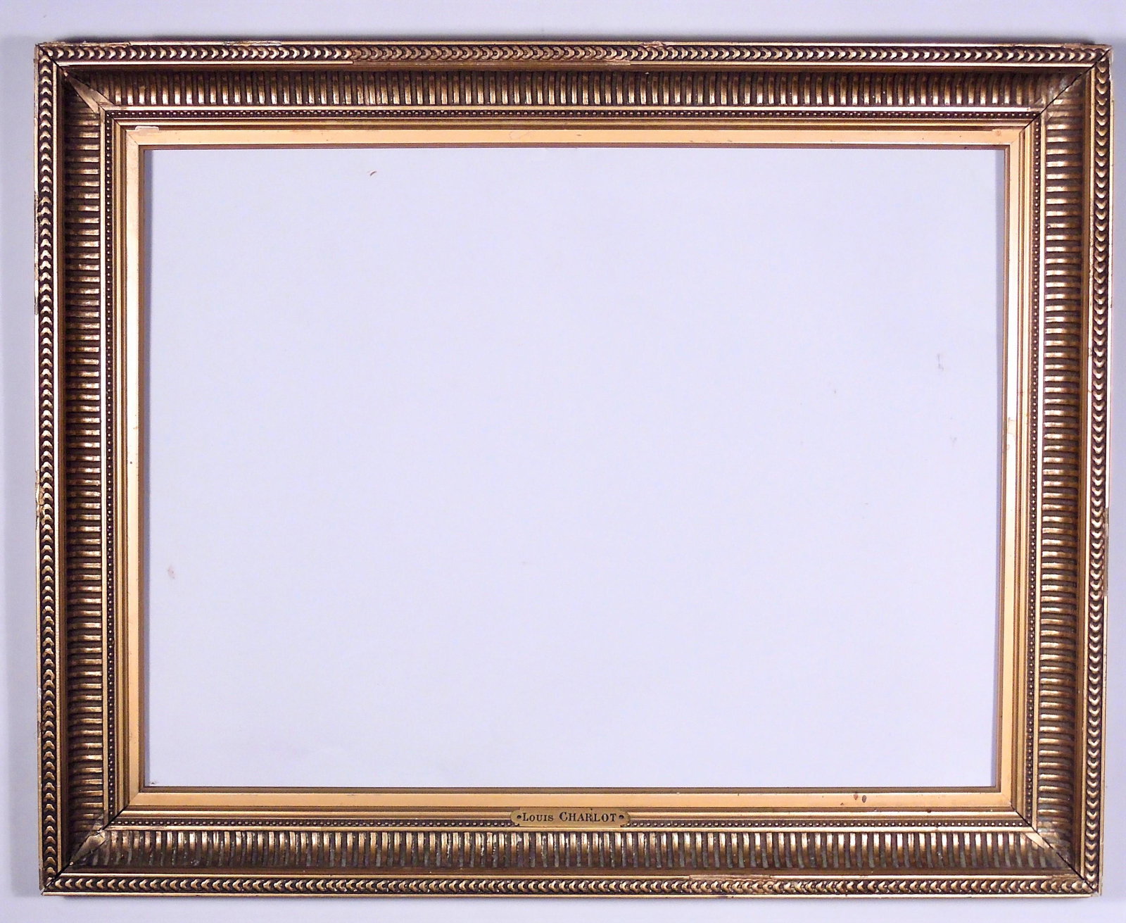 19th Century Hudson River School Gilt Frame: Fluted cove frame with guilloche top edge, retains nameplate for "Louis Charlot." Rabbet: 14 3/4" x 19 3/4" Overall Dimensions: 19 1/4" x 24" Molding Width: 2 1/2"