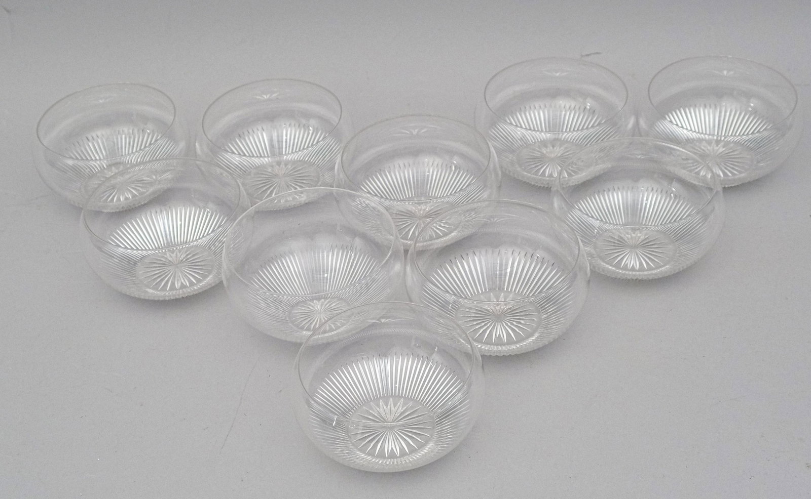 Set of 10 Cut Crystal Ice Cream Dishes: Of fine quality with deep cuts and star footed together with large frosted glass campagna form wine cooler, 5 1/4" diameter.