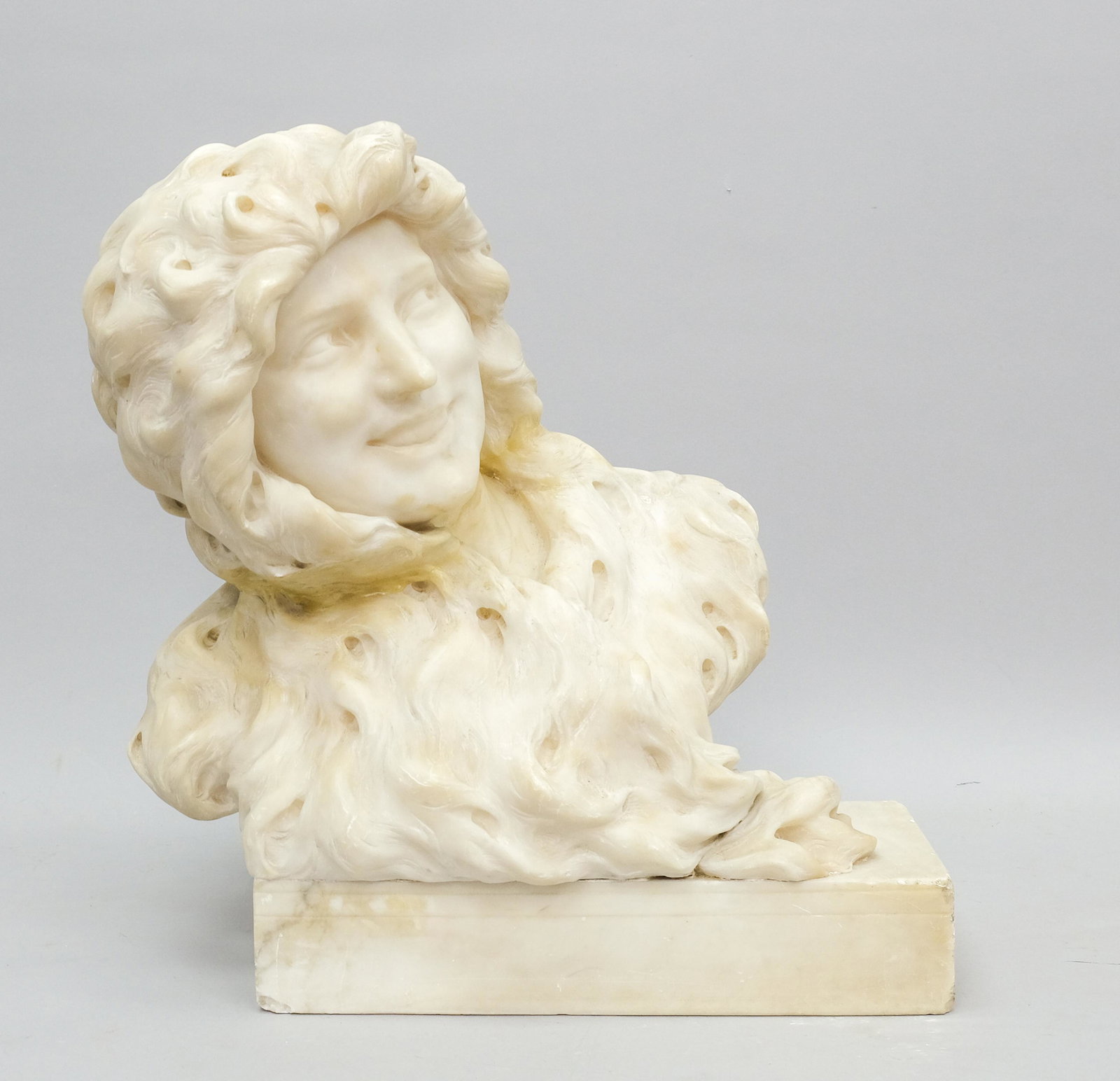 Large Alabaster Bust of Smiling Woman: Well carved and large alabaster bust of smiling woman with flowing hair on square base, 15" X 16 1/2".