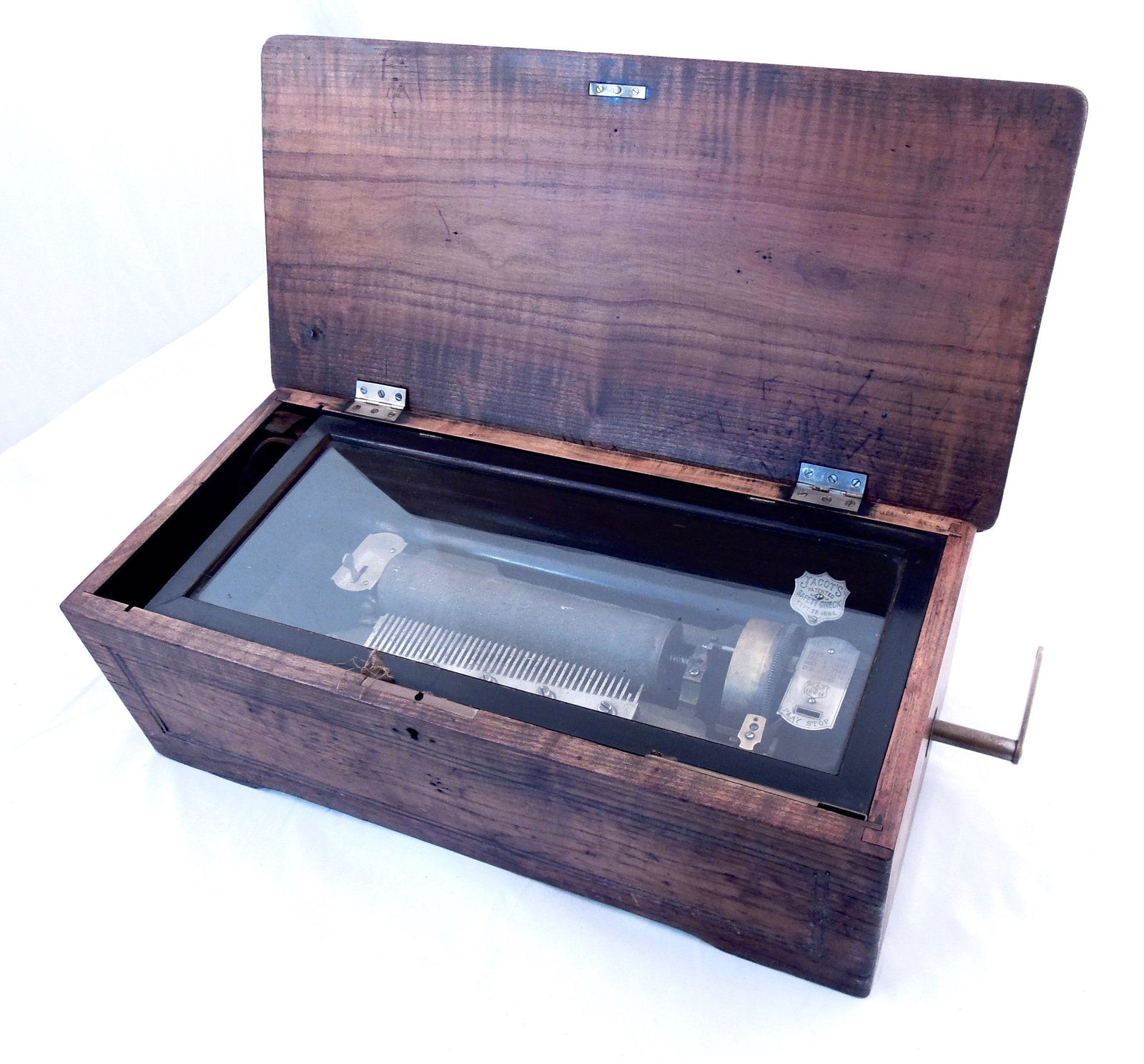 Antique Music Box: Large antique music box with wood casing. Jack Jacot's pat. 1886 music box. 19 3/4" X 6 3/4" X 9 1/4"