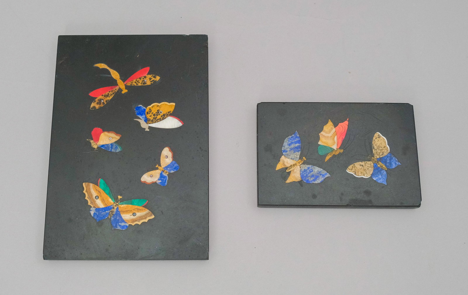 Lot of 2 Pietra Dura Butterfly Plaques: Multi colored butterflies featuring various lapidary elements. Nicely detailed wings and incised appendages, larger 6 3/4" X 4 1/2"