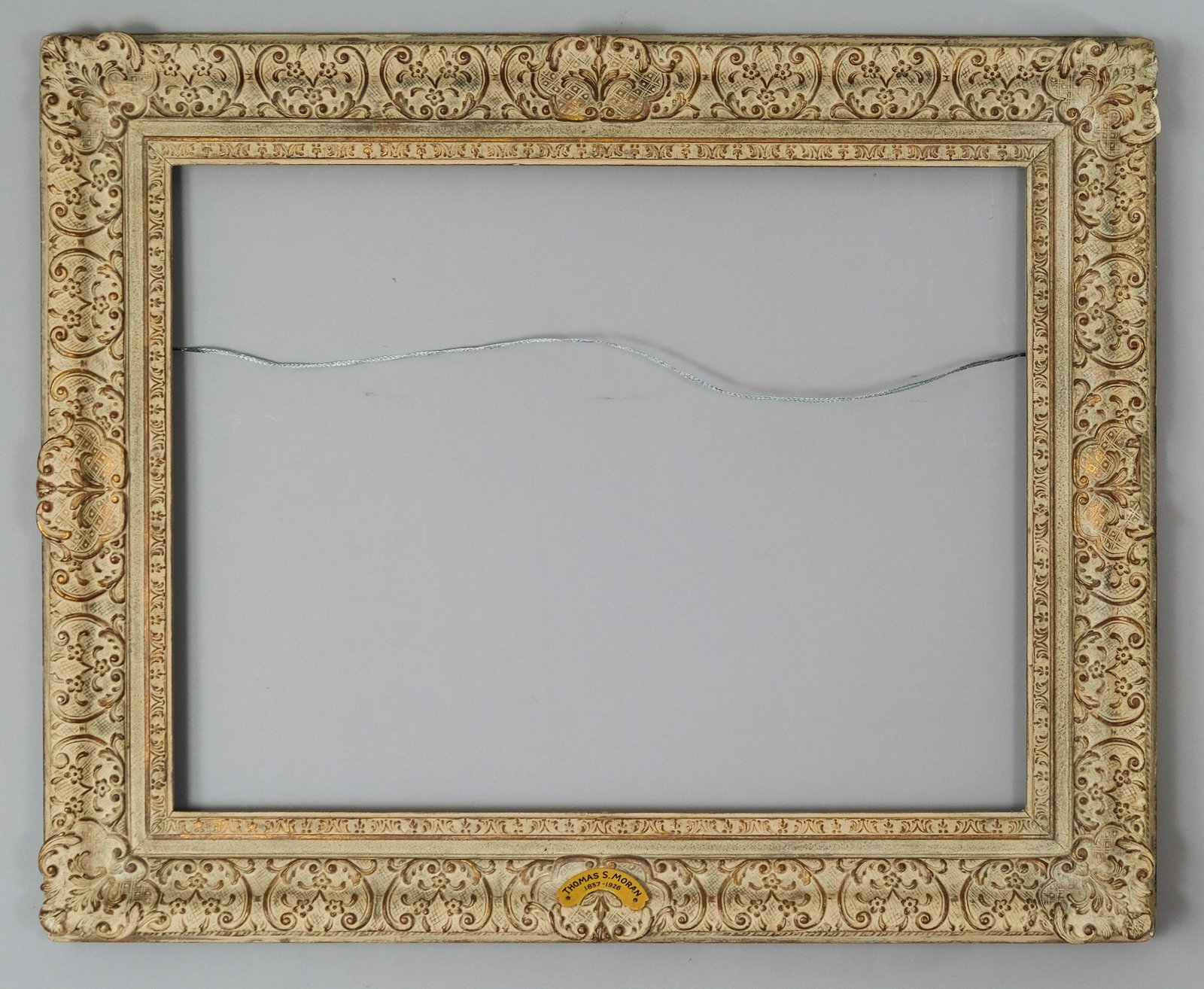 Louis XIV Style Montparnasse Frame: French circa 1930. original gilded and antiqued surface. Bears gilded name plate Thomas S. Moran 1837-1926. Rabbet 20" X 26" overall 27" X 33" molding width 4"