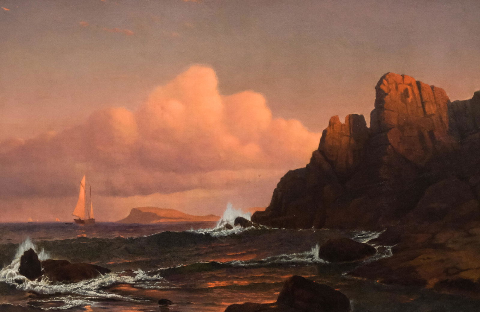 Francis Augustus Silva, Red Sails At Sunset: Francis Augustus Silva (American, 1835-1886) Oil on canvas masterpiece depicting a luminist seascape at twilight with red light reflected on the sails of a small schooner, with waves crashing on a roc