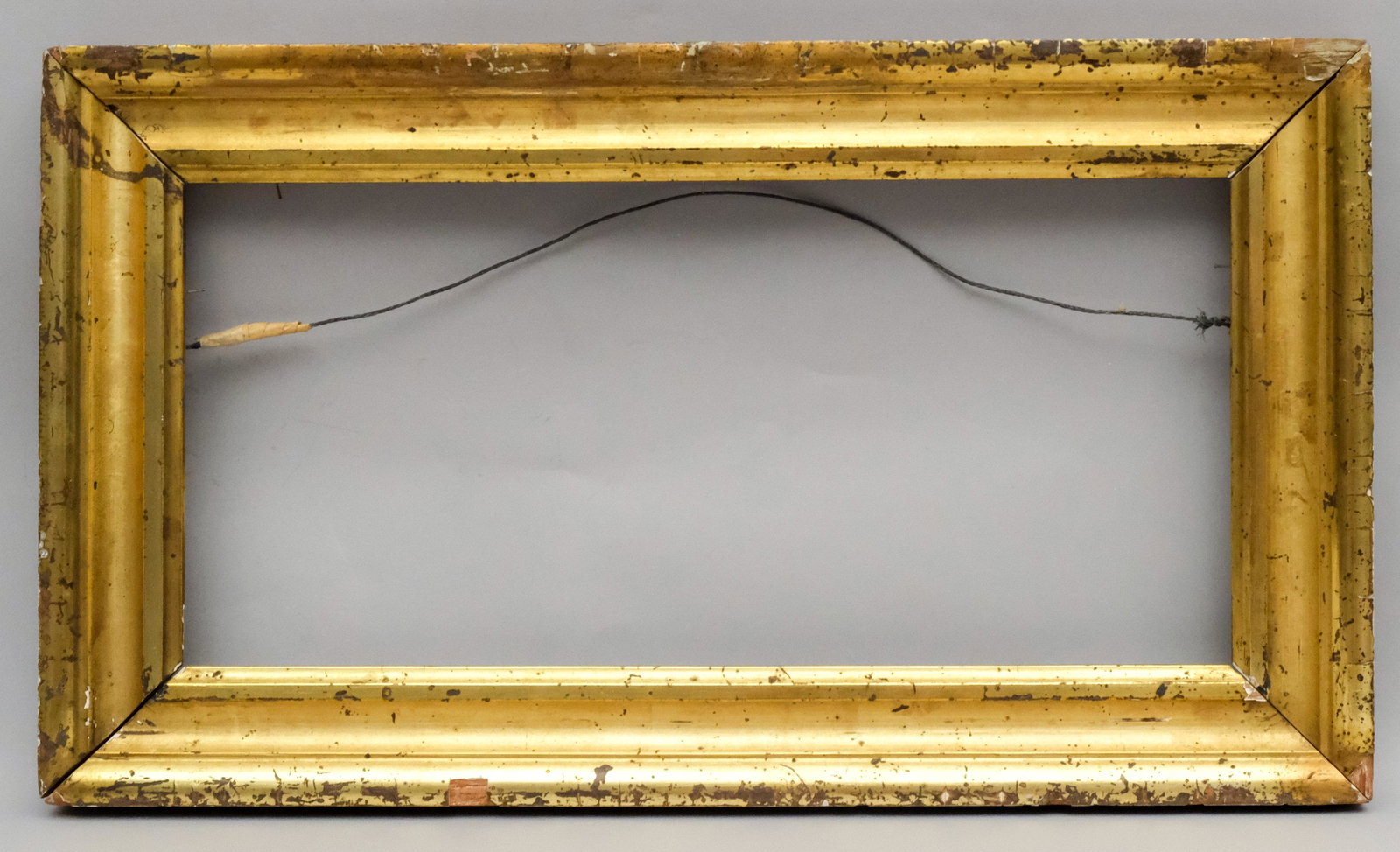 American Lemon Gold Frame: American circa 1860, bright lemon gold. Rabbet 8" X 16 1/4" Overall 11 1/4" X 19 1/2" Molding width 2"