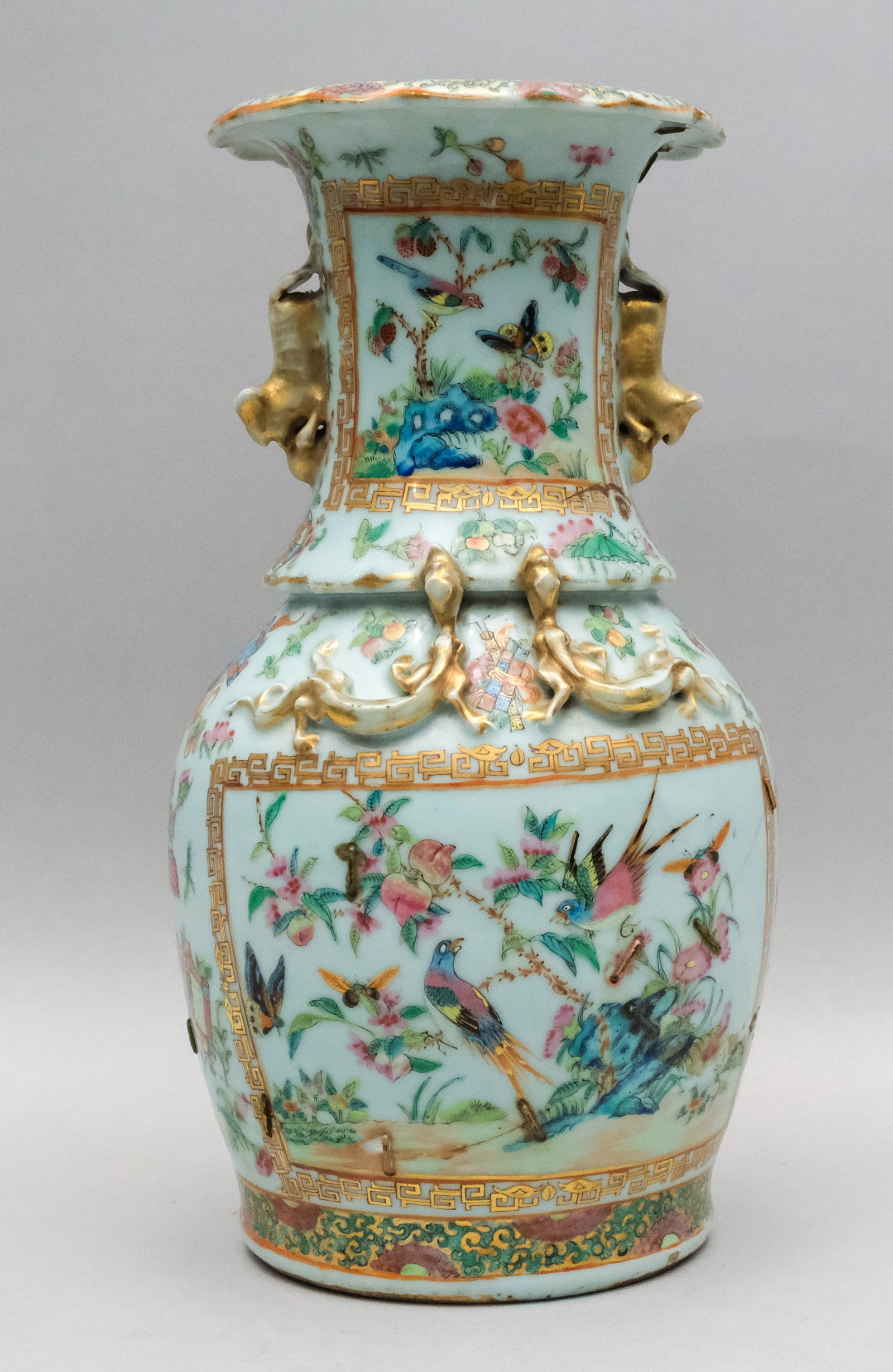 Fine Quality Rose Medallion Vase: Decorated with various birds, bugs, butterflies, and flowers in gilit cartouches, along with applied foo dogs and dragons, also in gold. Bearing old Charles Street restoration label on bottom. 13 1/2"