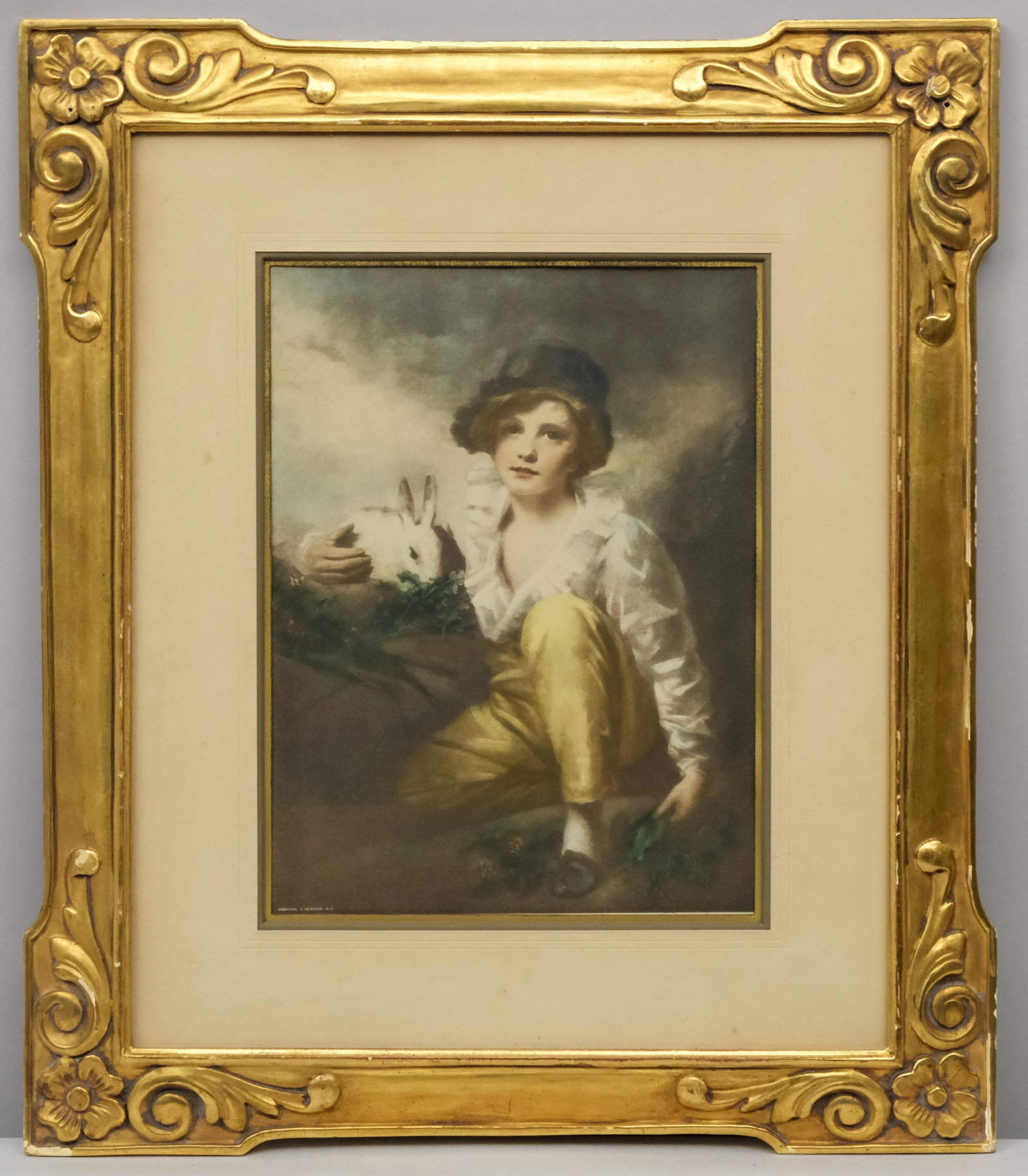 Foster Brothers Art Nouveau Gilt Frame: Foster Bros., Boston, ca. 1910, hand carved and gilded frame together with a hand colored print of a boy and rabbit. Rabbet 14" X 17" overall 17 3/4" X 20 3/4" molding width 1 3/4"