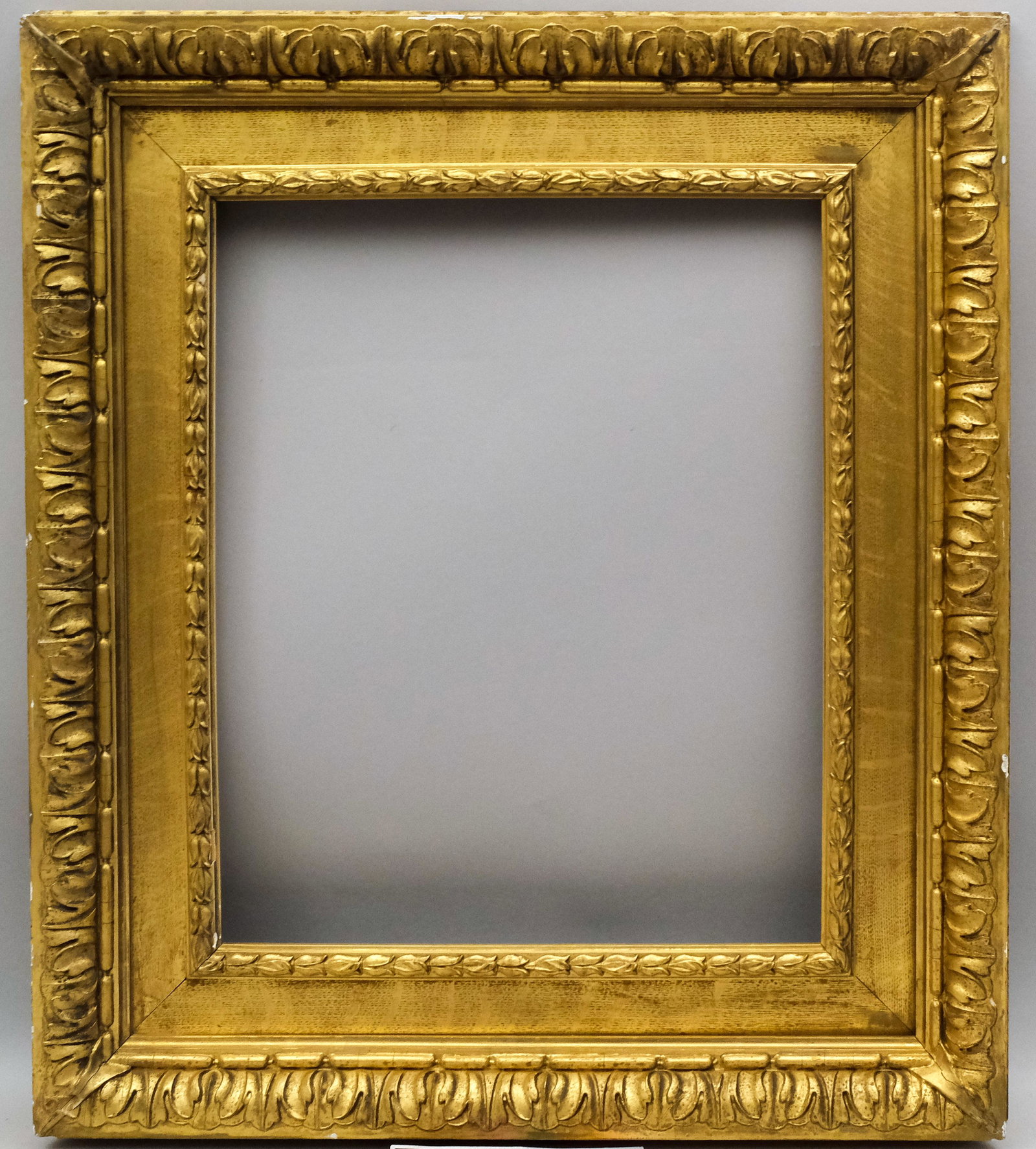 Pre-Raphaelite Watts Style Gilt Oak Frame: English, ca. 1880, gilded oak cassetta profile with acanthus top edge, maker's label for "James McClure & Son, Glasgow, Carvers by Special Appointment to the Late Queen Victoria" verso. Rabbet: 17 1/2