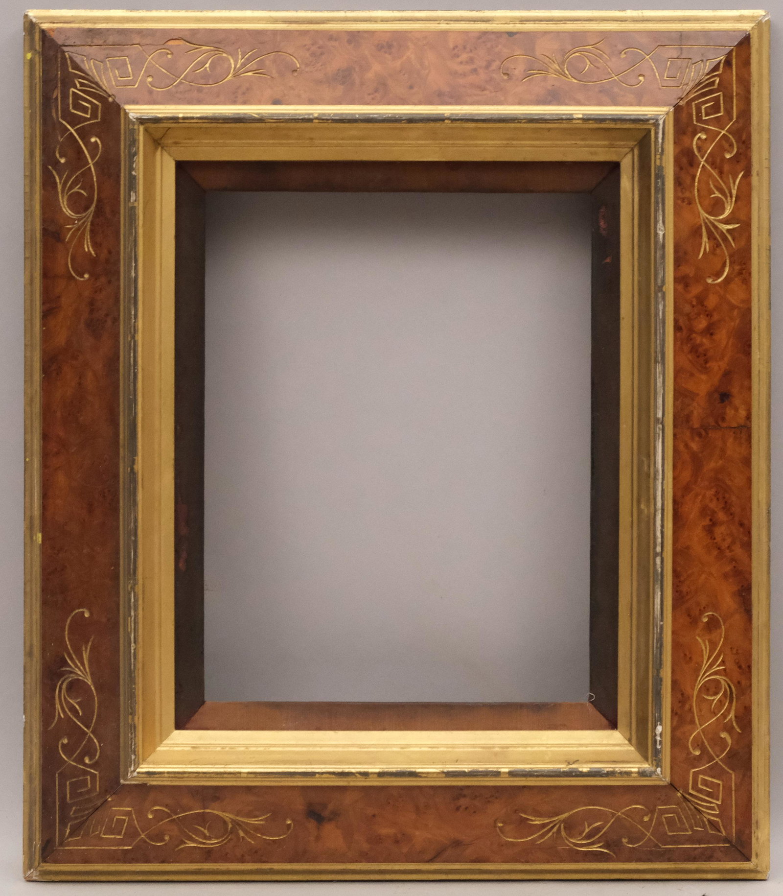 American Eastlake Lemon Gold and Faux Bois Frame: American, ca. 1870, gilded and incised reverse profile and velvet liner. Rabbet: 10" x 13" Overall Dimensions: 18 1/2" x 21 1/2" Molding Width: 4 1/2"