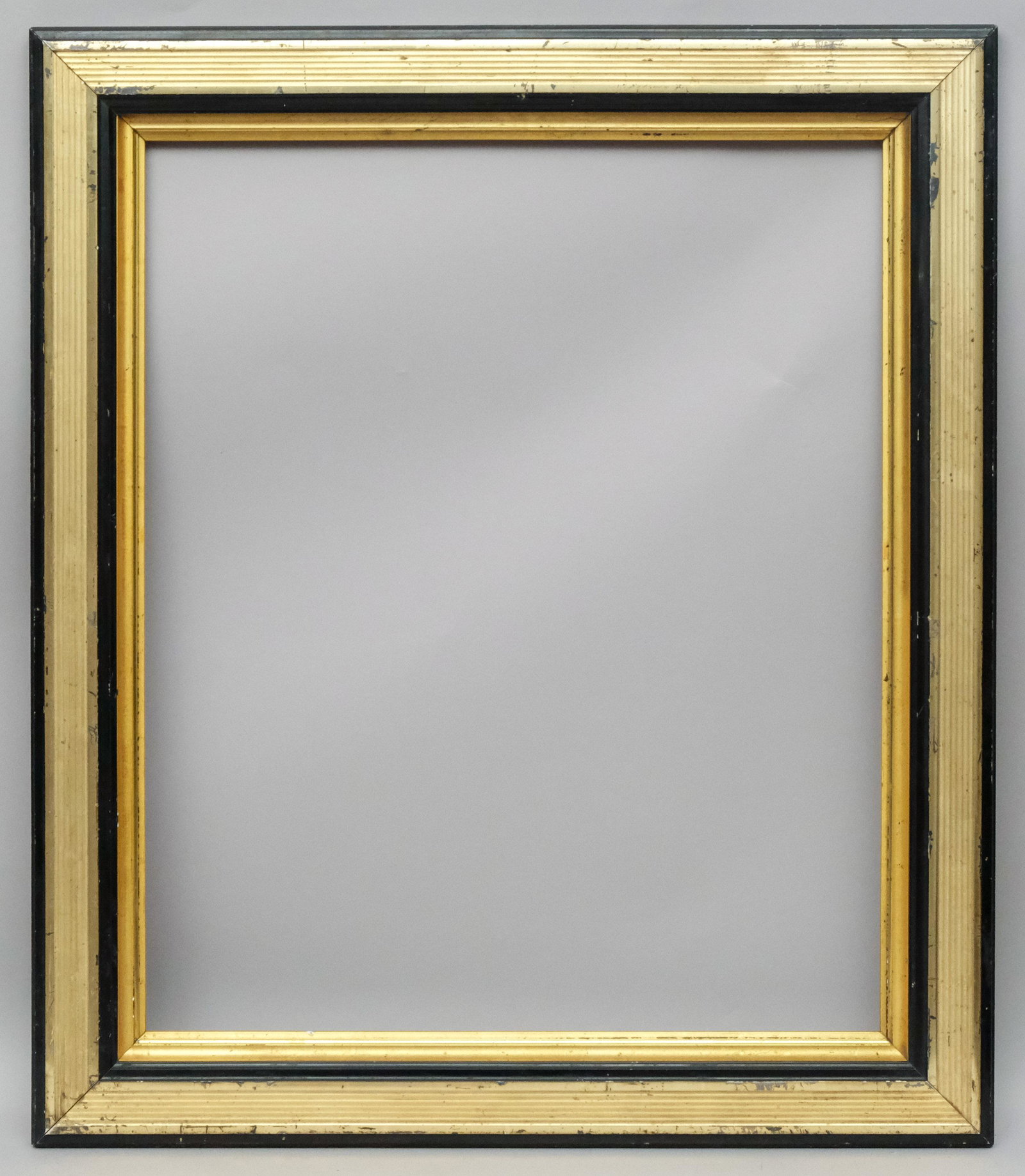 American Lemon Gold Gilt and Ebonized Frame: American, ca. 1860, flat reeded profile with ebonized accents and gilt liner. Rabbet: 22" x 26 1/2" Overall Dimensions: 28" x 32 1/2" Molding Width: 3 1/4"