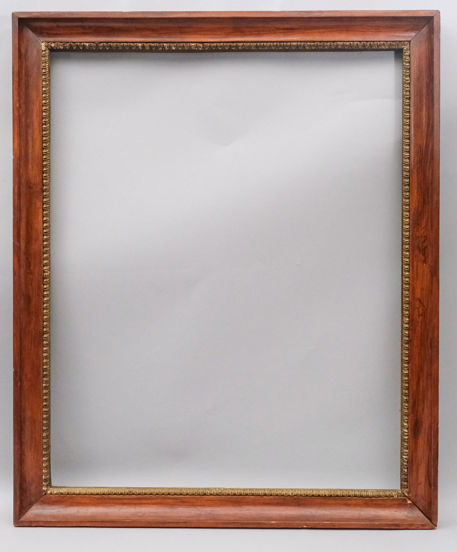 Biedermeier Rosewood and Gilt Frame: Austrian, ca. 1820, cove molded frame with rosewood veneer and carved and applied lambs tongue giltwood liner. Rabbet: 31" x 39" Overall Dimensions: 36 1/4" x 44" Molding Width: 3"