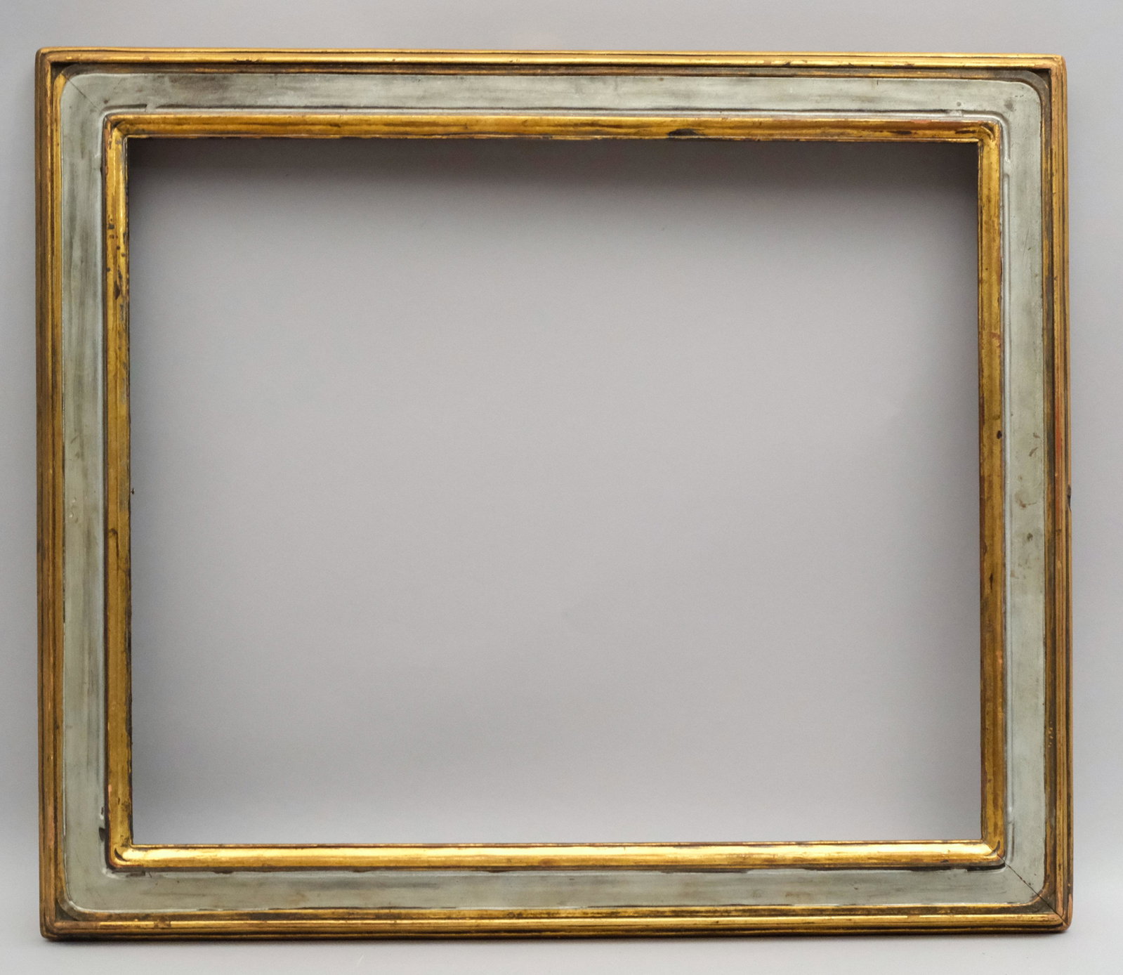 Newcomb Macklin Gilt & Polychromed Frame: Newcomb Macklin, ca. 1920, hand carved and gilded with art nouveau motifs in a great standard size, bears label for Newcomb Macklin verso. Rabbet: 20" x 24" Overall Dimensions: 25" x 29" Molding Width