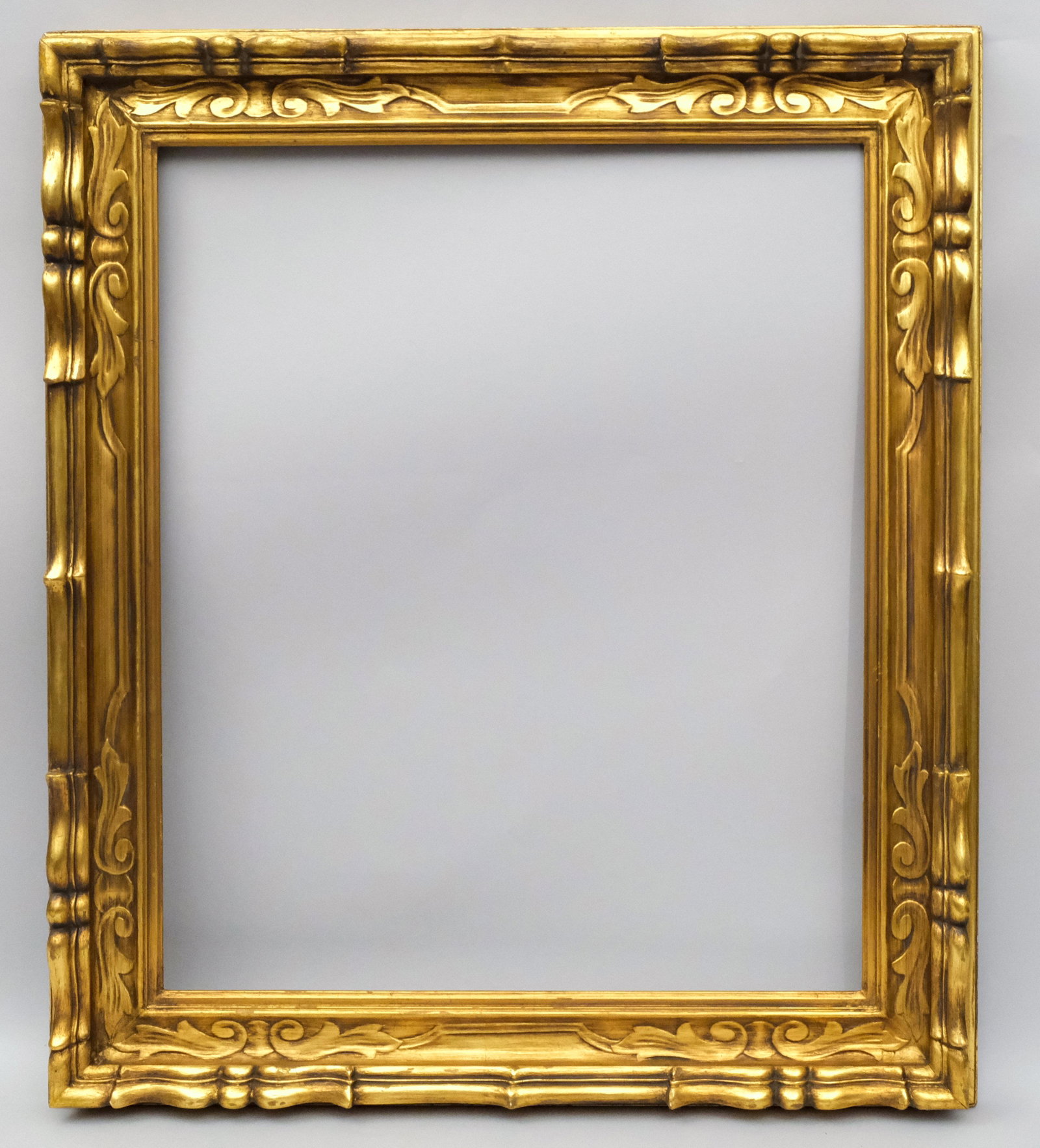Newcomb Macklin Style Gilt Frame: Exquisitely hand carved and gilded Arts & Crafts frame, possibly made by Newcomb Macklin in a great standard size. Rabbet: 25" x 30" Overall Dimensions: 32.5" x 37.5" Molding Width: 4"