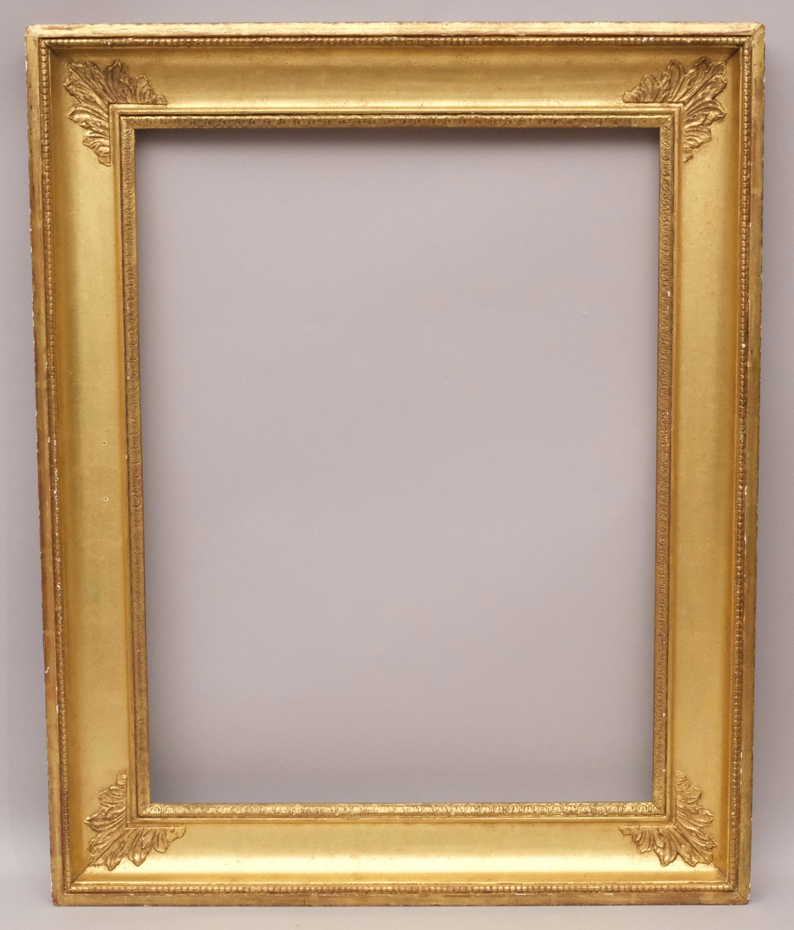 American Custom Giltwood Frame: American 20th century. Finely wrought custom frame in the Hudson River school or French Empire style. Rabbet 20" X 26" overall 26 3/4" X 33 1/4" molding width 3 3/4"