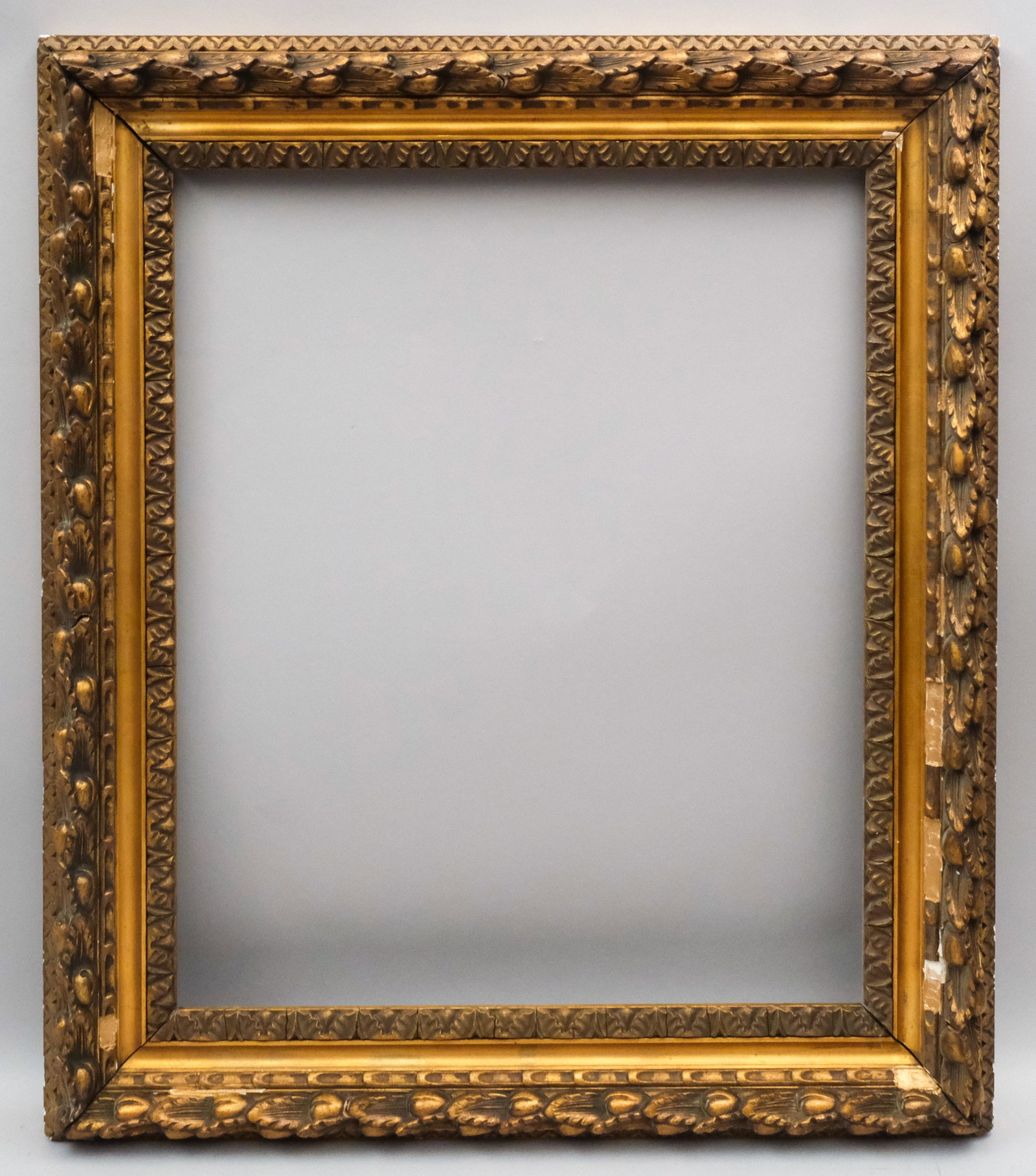 American Giltwood Frame: American, ca. 1900, having olive and leaf decorated top edge, the olive was sacred to Hermes. Rabbet: 20" x 24" Overall Dimensions: 26 3/4" x 31" Molding Width: 3 3/4"