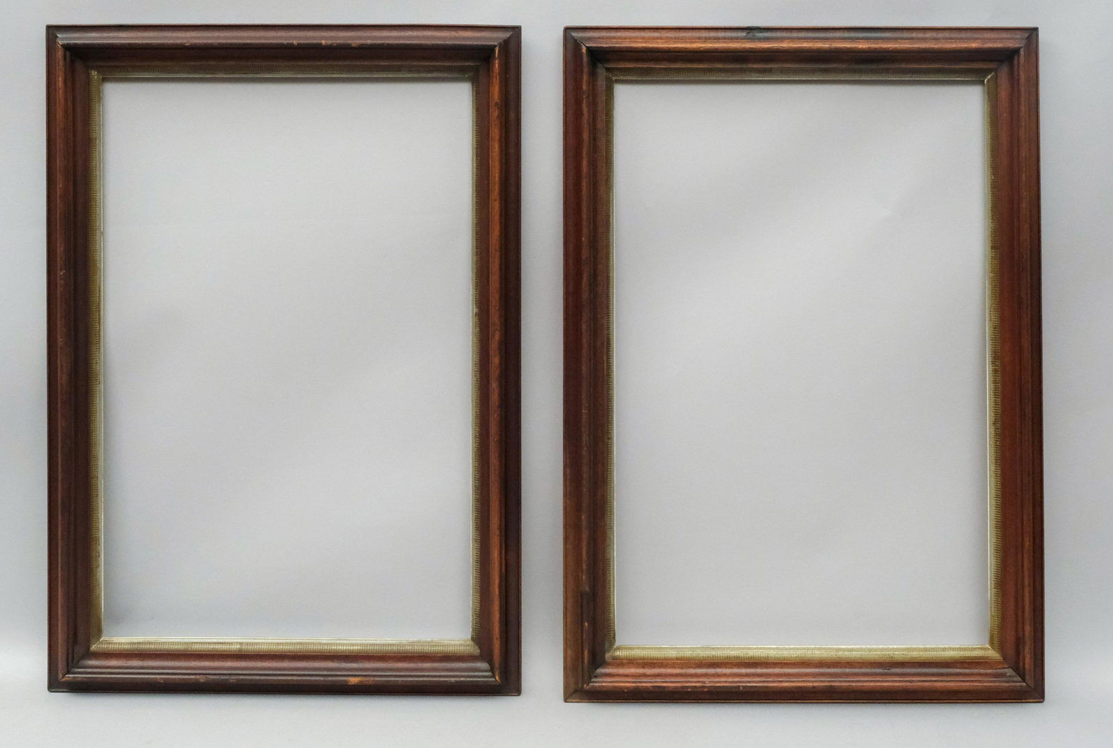 Pair of American Walnut Frames With Gilt Liners: American, ca. 1860, cove molded walnut frames with stenciled lemon gold liners. Rabbet: 17 1/2" x 26 1/2" Overall Dimensions: 21 3/4" x 30 3/4" Molding Width: 2 1/2"