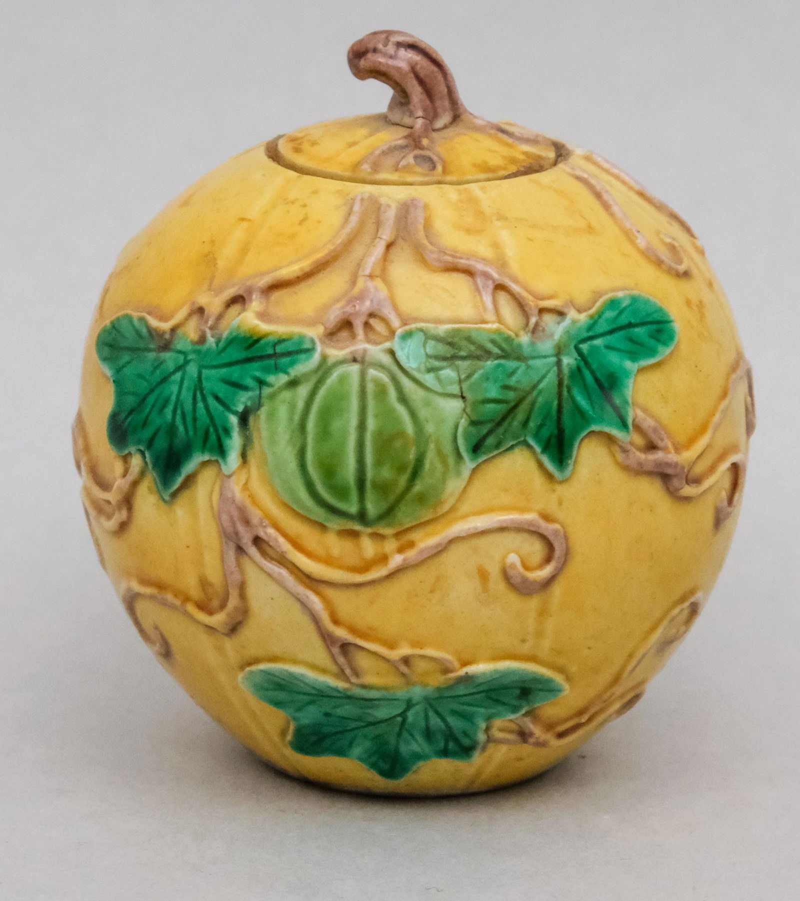 Chinese Pottery Melon or Gourd Box: Small size in yellow mustard glaze with applied leaves and naturalistic incised detail. Marked "China" on bottom. 2 3/4".