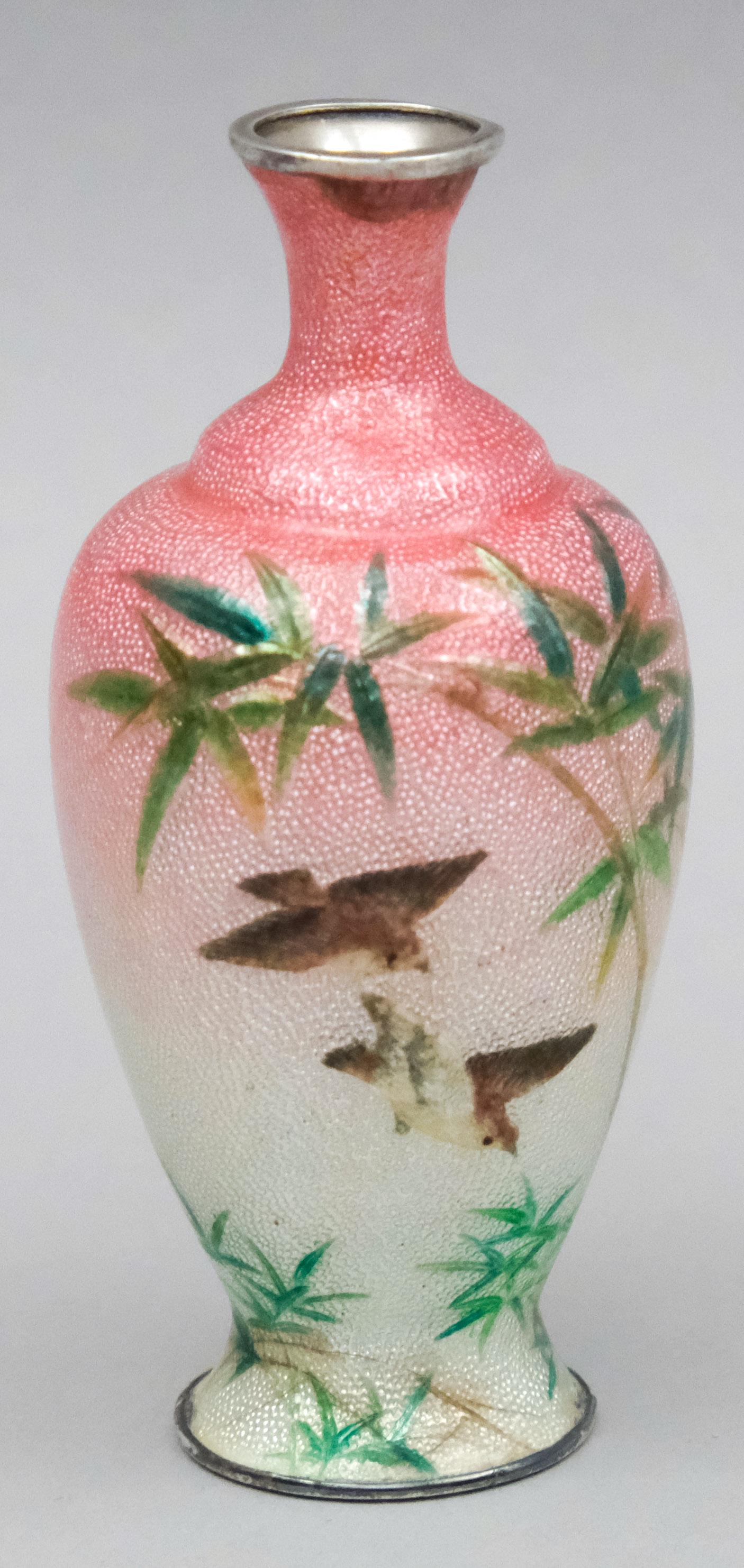 Silver Mount Artist Signed Cloisonne Cabinet Vase: Pink to white foil field decorated with bamboo groves and birds in flight. Signed on bottom. 3 1/2".