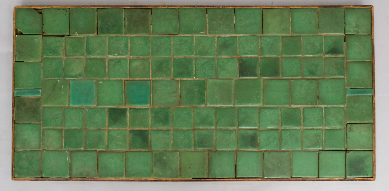 Large Matte Green Grueby Attr. Tile Tabletop: Large Arts & Crafts tile top, with the tiles attributed to Grueby. 25 1/4" x 51 1/2".