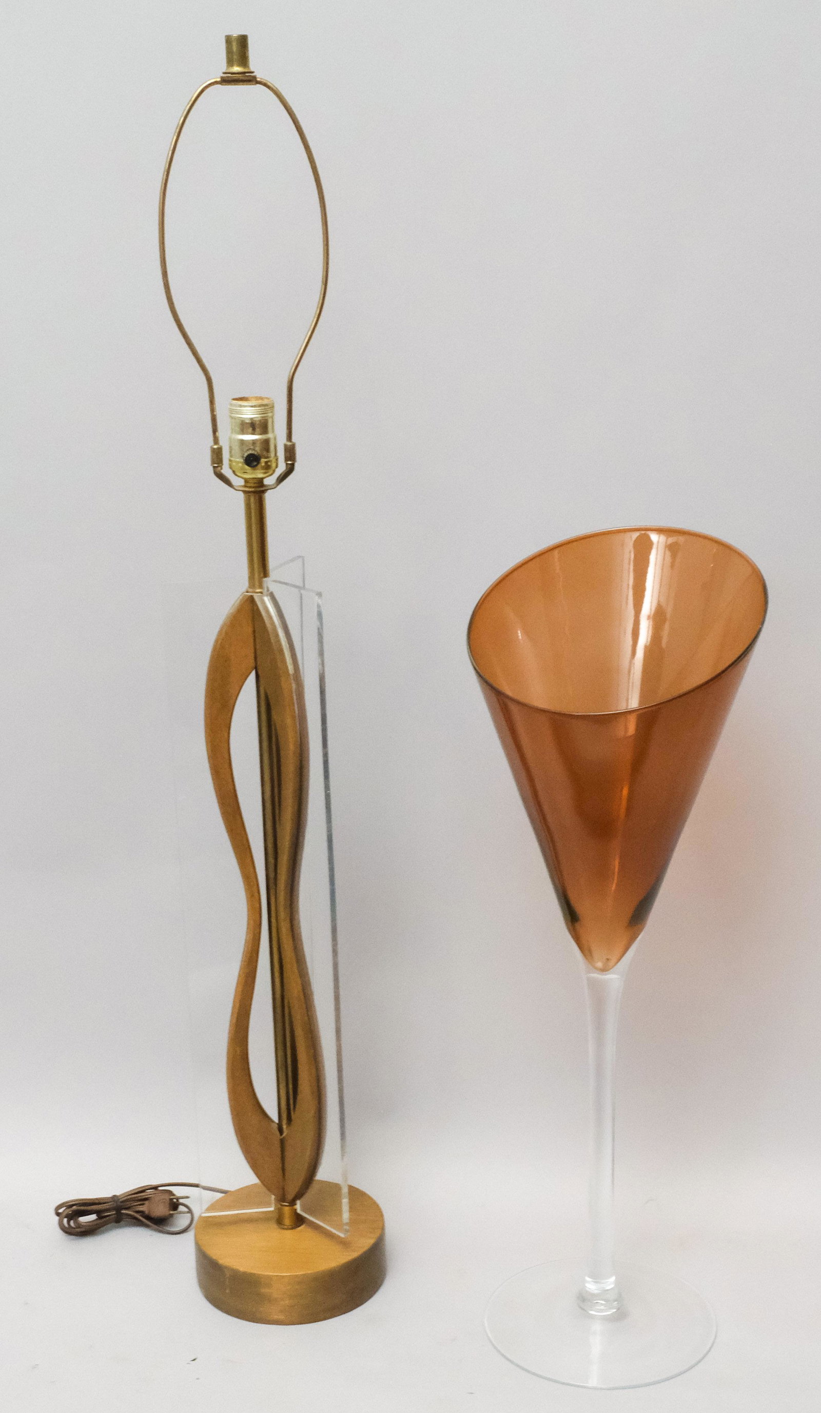 Decorative Mid Century Lot: Comprising a wood & lucite organiform lamp and a large dark amber "martini" glass vase. Lamp 37" and the vase 23 1/4".