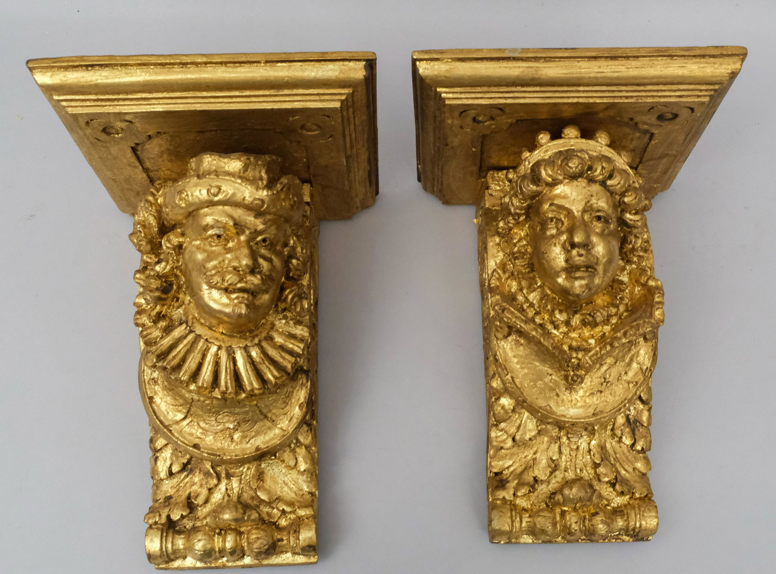 Pair Gilt Carved Elizabethan Style Wall Brackets: Carved figural form of queen and musketeer. 7" x 10".