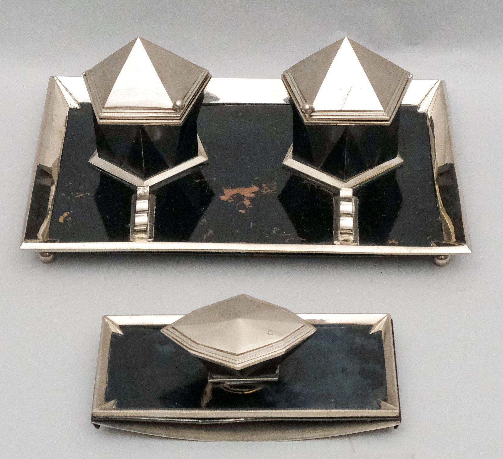Art Deco Cubist 2-Piece Desk Set: Large bronze and plated double pot inkwell with pen tray and rocker blotter with great cubist styling. Inventory or museum number on bottom of stand. Otherwise unmarked. Inkwell 7 5/8" x 11 1/2".