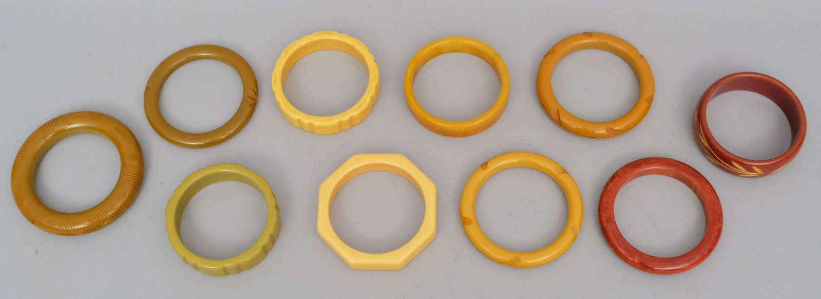 Lot of 10 Bakelite Bracelets: Various colors and motifs. Some with incised decoration.