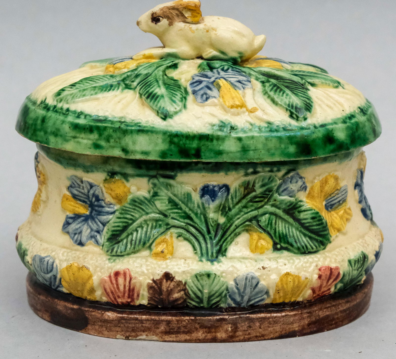 Figural Rabbit Majolica Sugar Box or Butter Dish: Majolica or Prattware with lovely applied polychrome elements and a figural rabbit finial on delicate thin body. 4 1/4" x 5 1/4".