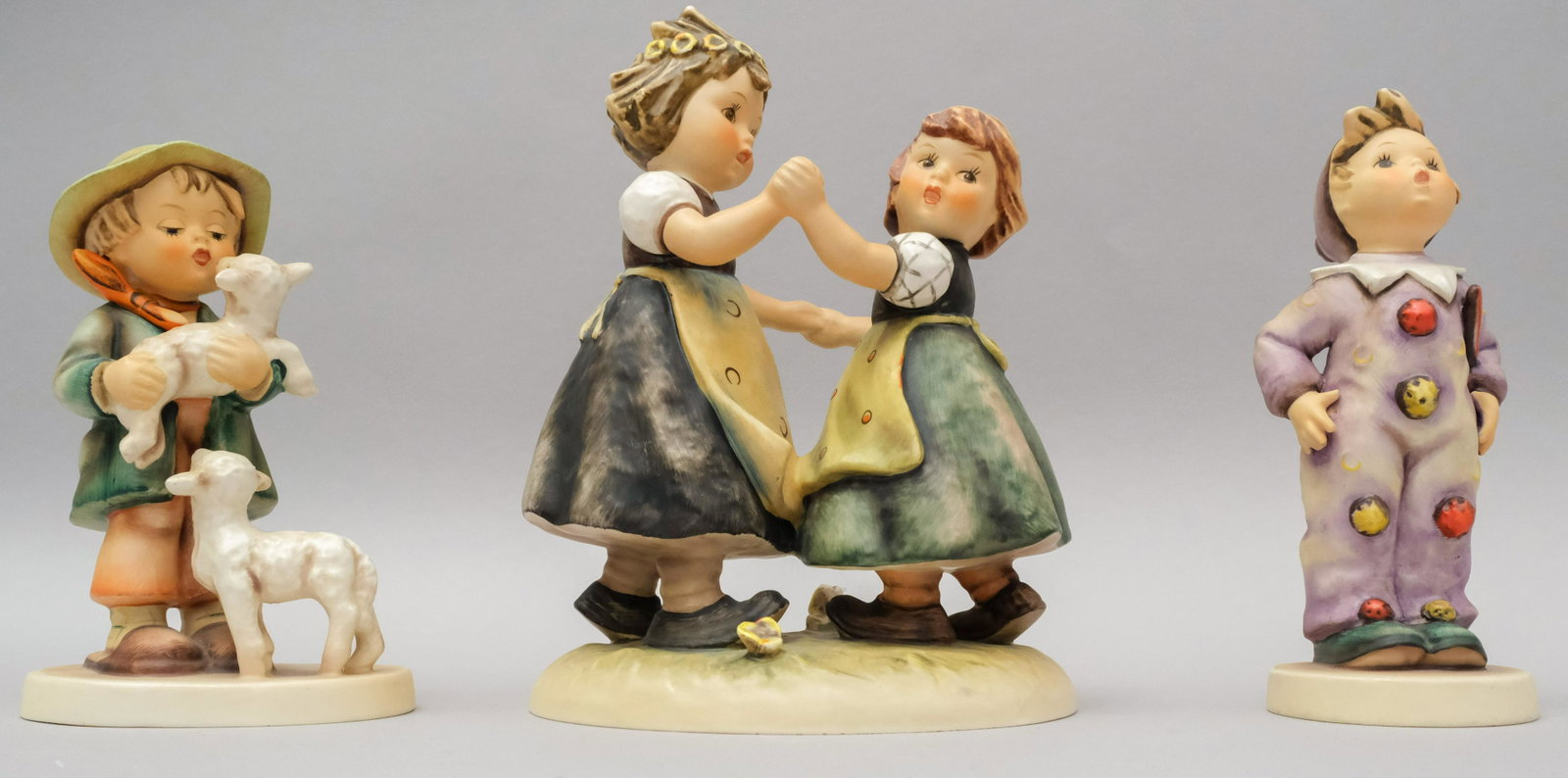 Lot of 3 Hummel Figurines: All marked as shown. Sizes from 5 3/8" to 7".