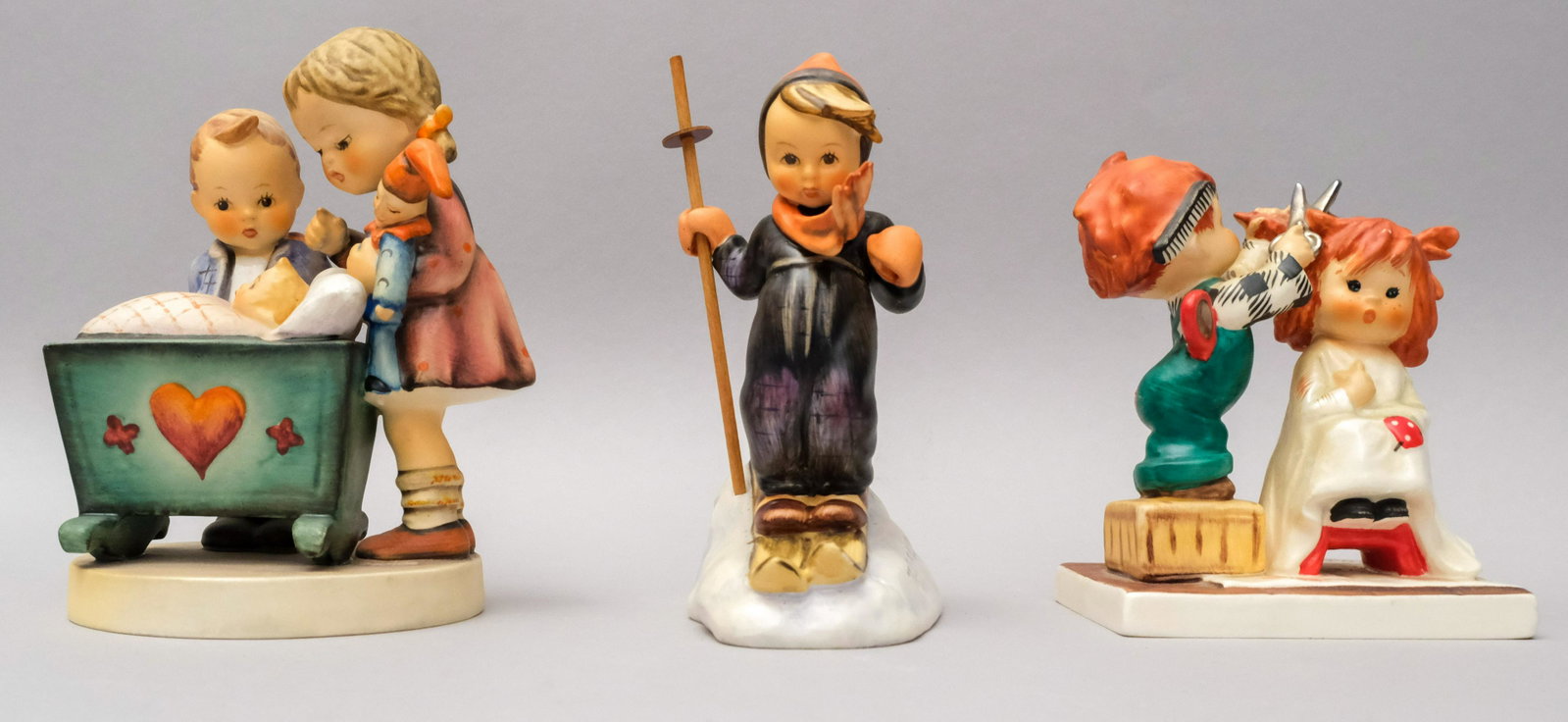 Lot of 3 Hummel Figurines: All marked as shown. Sizes from 4 3/4" to 5 1/4".