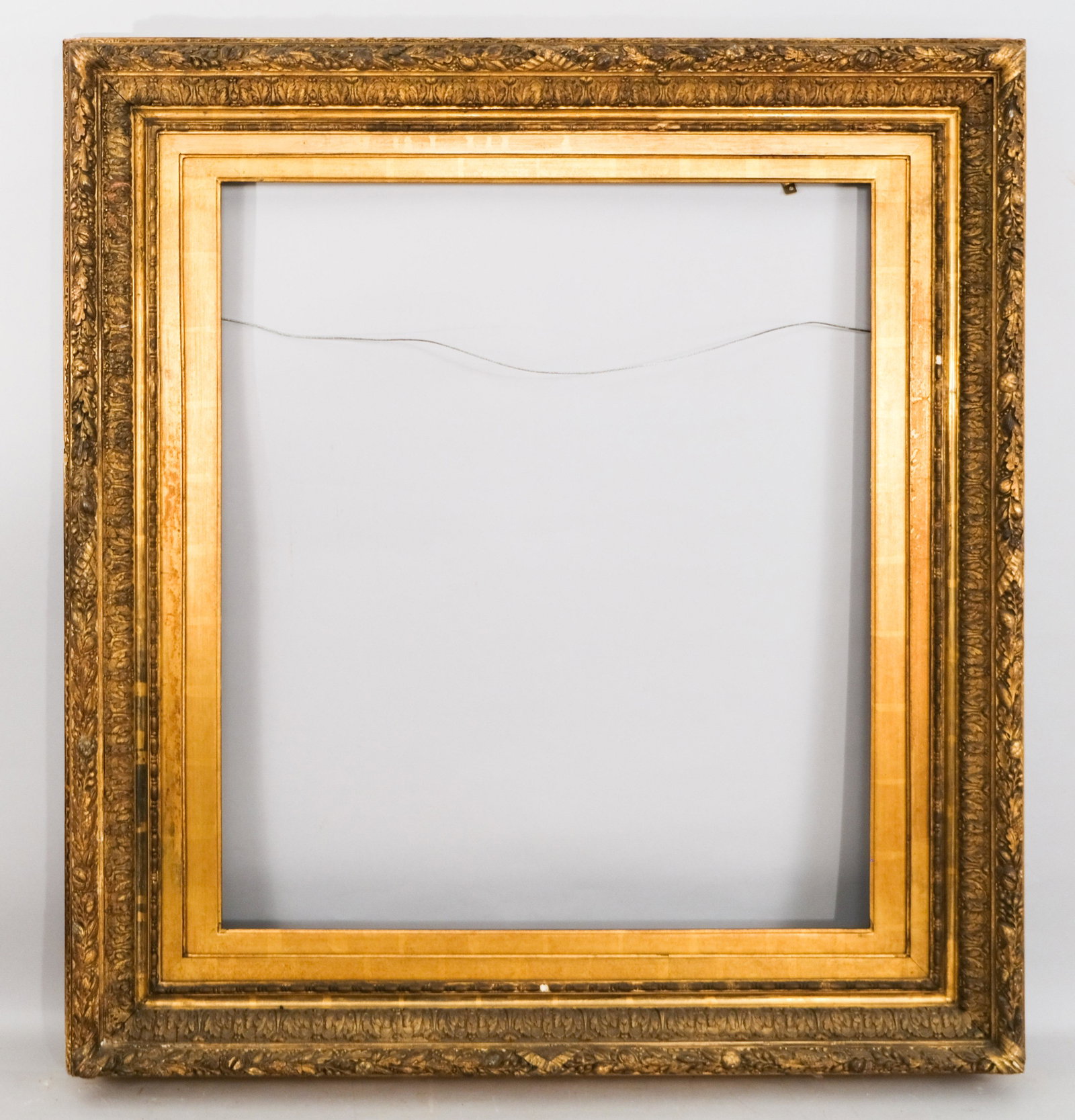 American Hudson River School Gilt Frame: American, ca. 1870, fruit and berry top edge with acanthus ogee, having added non-symmetrical liner. Rabbet: 27" x 31" Overall Dimensions: 39 1/2" x 42 1/2" Molding Width: 6 1/2"
