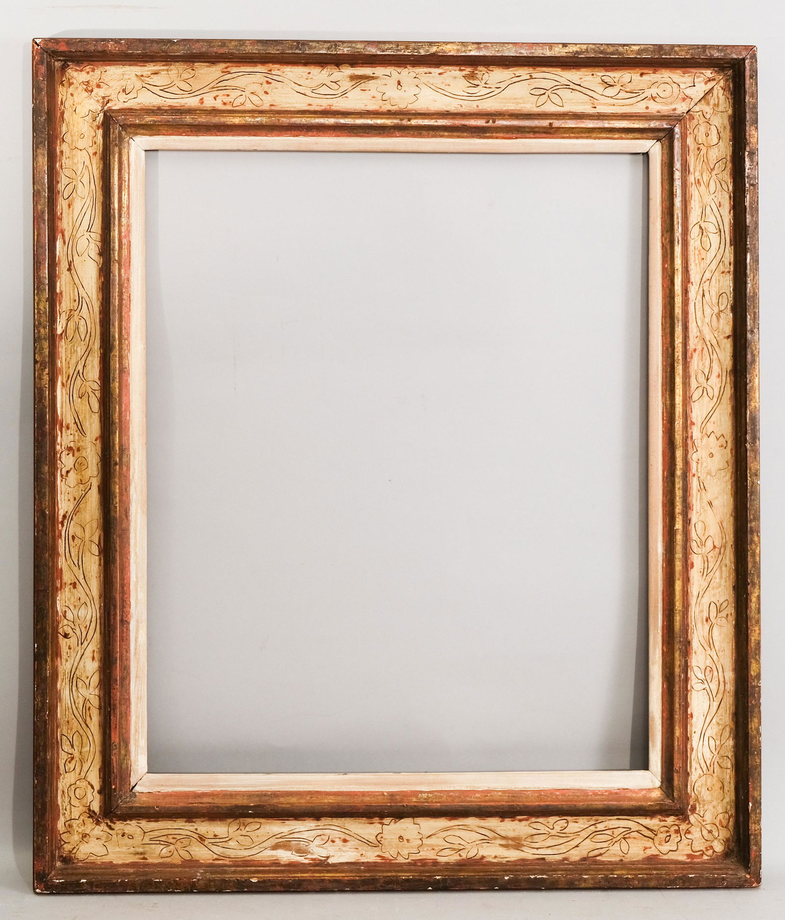 Max Kuehne Gilt and Polychromed Frame: Max Kuehne, ca. 1930, lovely cassetta example with iconic Kuehne incising in the panel, toned silver leaf rubbed through to expose red bole, having white painted liner. Rabbet: 21" x 26" Overall Dimen