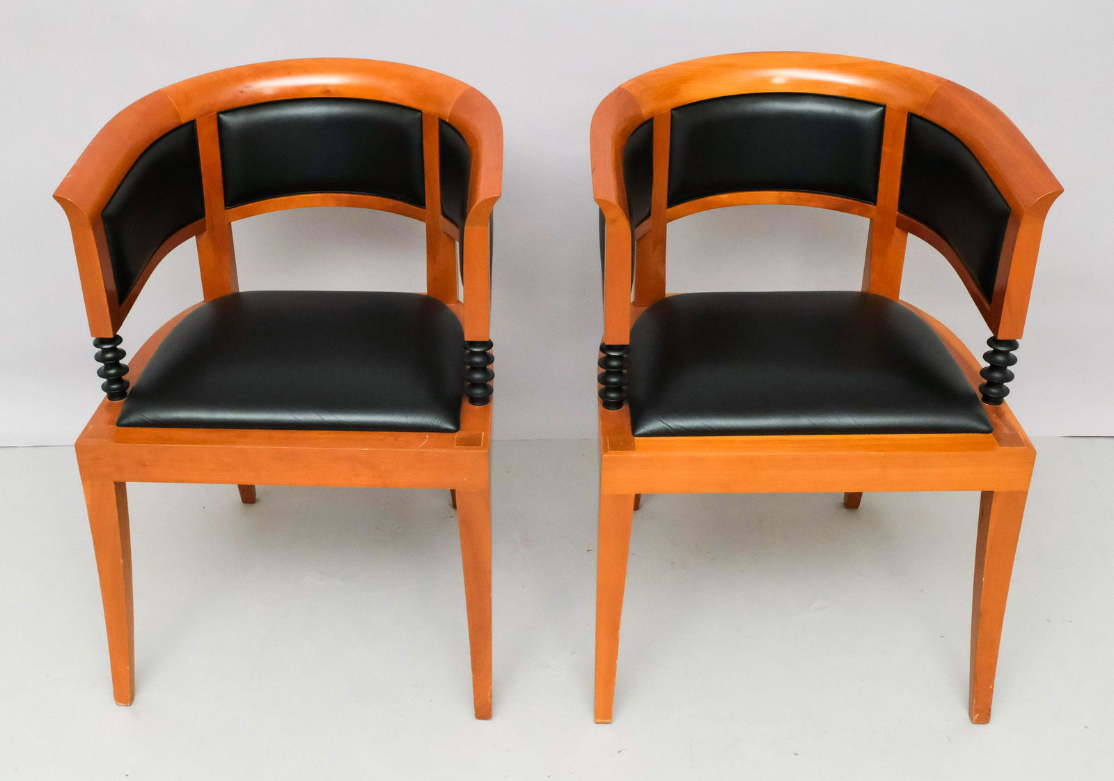Pair Leon Krier for Giorgetti "Salla Magna" Chairs: Leon Krier (Luxembourger, born 1946) for Giorgetti (Italian, founded 1898) Pair of 'Sella Magna' armchairs, late 20th century. Ebonized wood, cherrywood, leather. Brand to underside. Measuring 21 1/2"