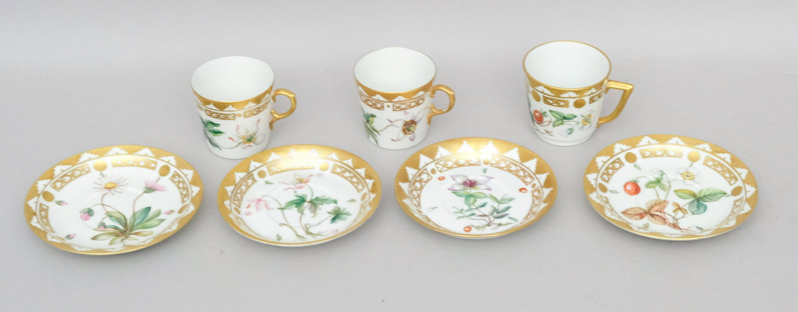 Group of 3 Royal Copenhagen Hand Decorated Cups: With generous gilding and botanical decoration, including flowers and strawberries. Marked as shown. Cups 2 1/4" tall.