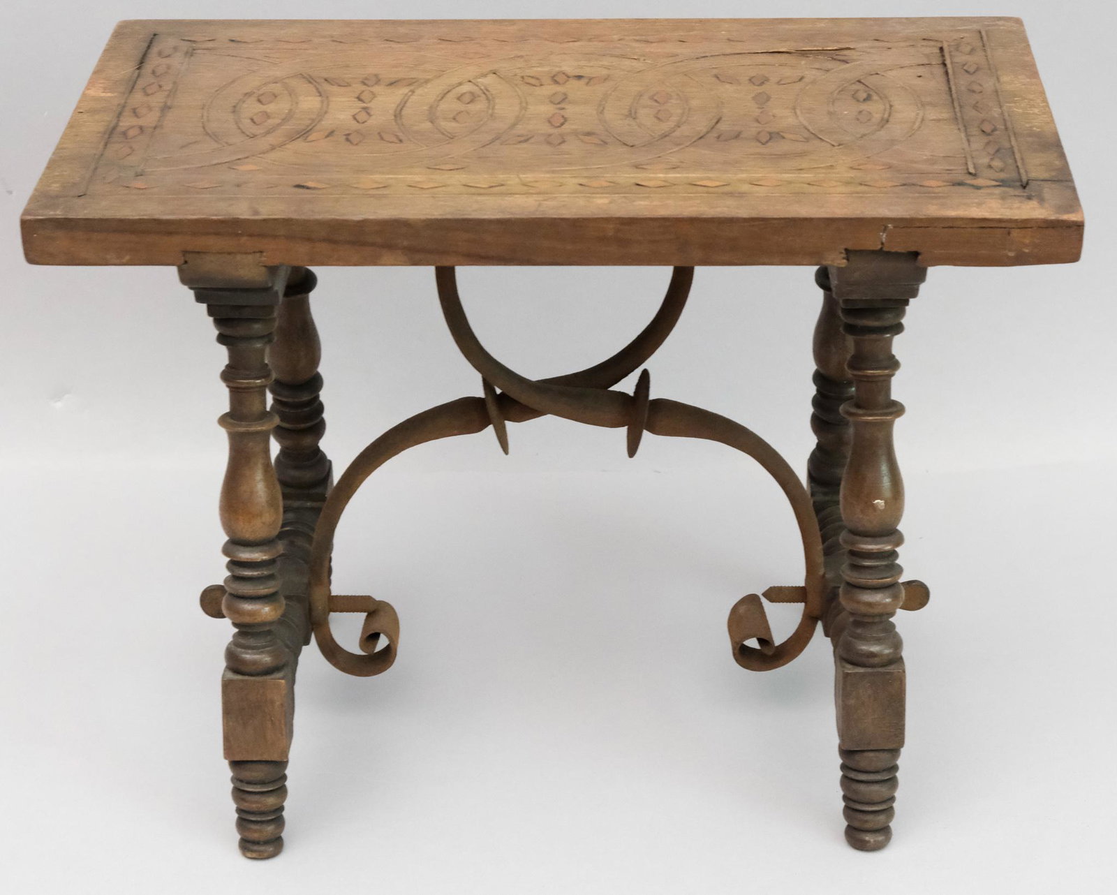 Antique Metal Inlaid Wooden Stool: With decorative iron stretcher and loop and diamond inlaid top top. 7" x 9 1/2" x 12 1/2".