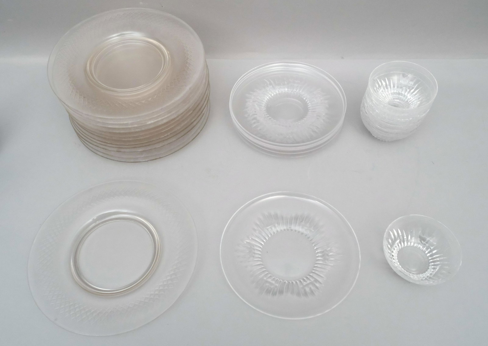 Group of Three Sets Cut Crystal Dinnerware: Comprising a set of 12 dinner plates, a set of 6 salad plates, and a set of 7 finger bowls. Bowls 4 3/8", dinner plates 10 1/2".