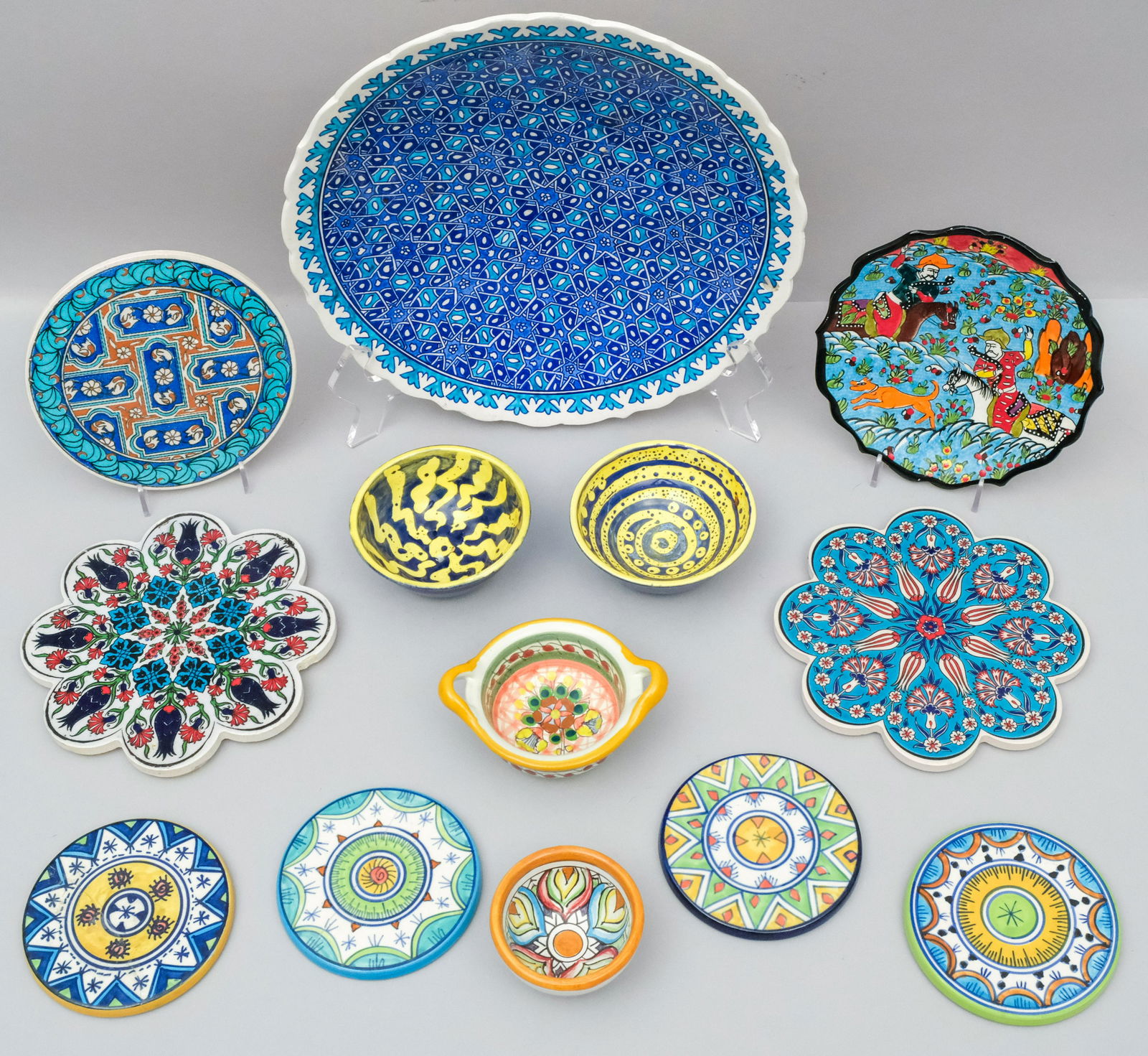 Collection of Turkish Art Pottery: Including dishes, coasters, trivets and bowls. Variously marked. 3" to 12".