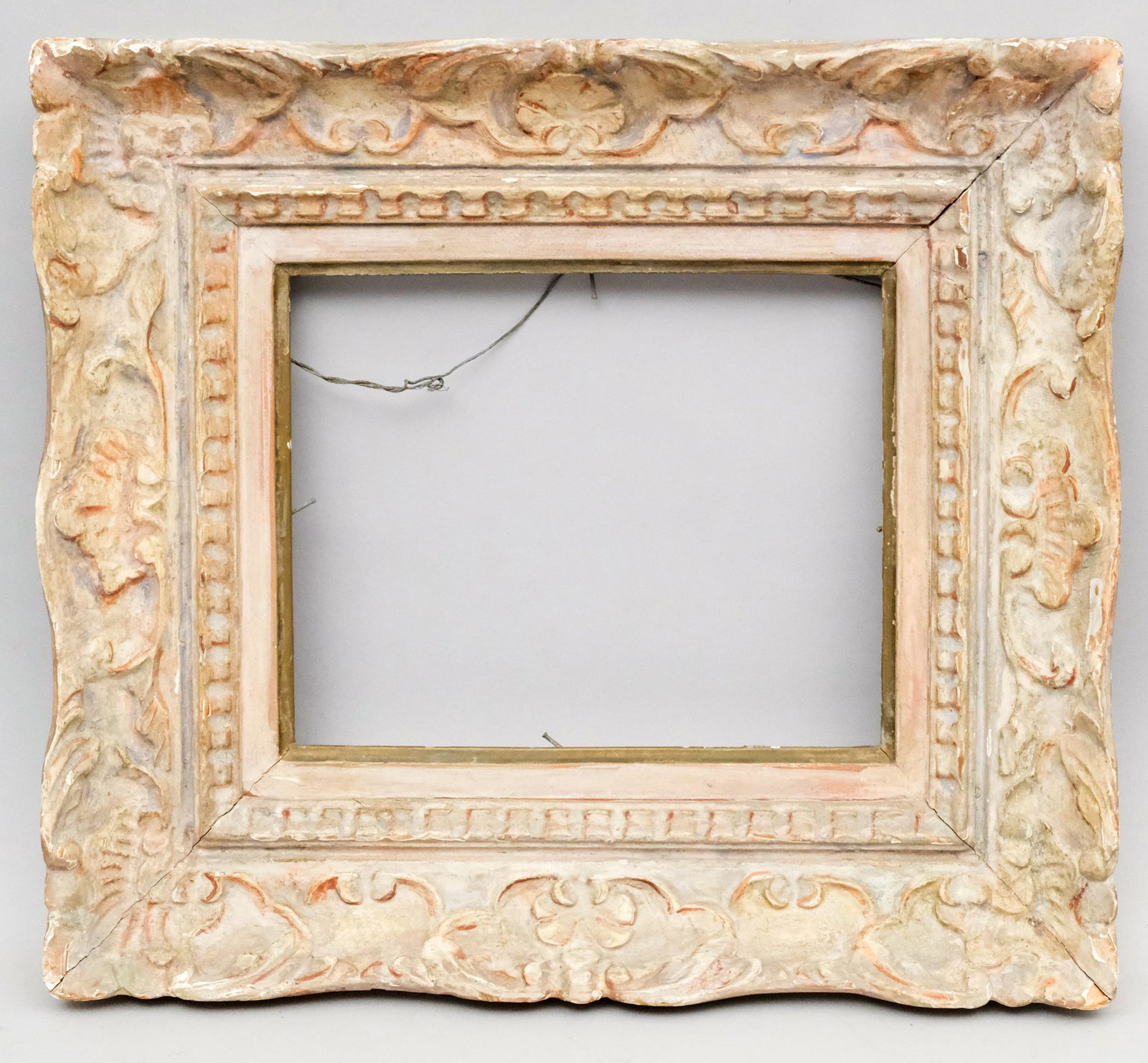 Louis XIV Style Montparnasse Frame: French, ca. 1930, hand carved and polychromed. One of a pair with Lot 224. Rabbet: 9" X 11" Overall: 16" X 18" Molding Width: 4"