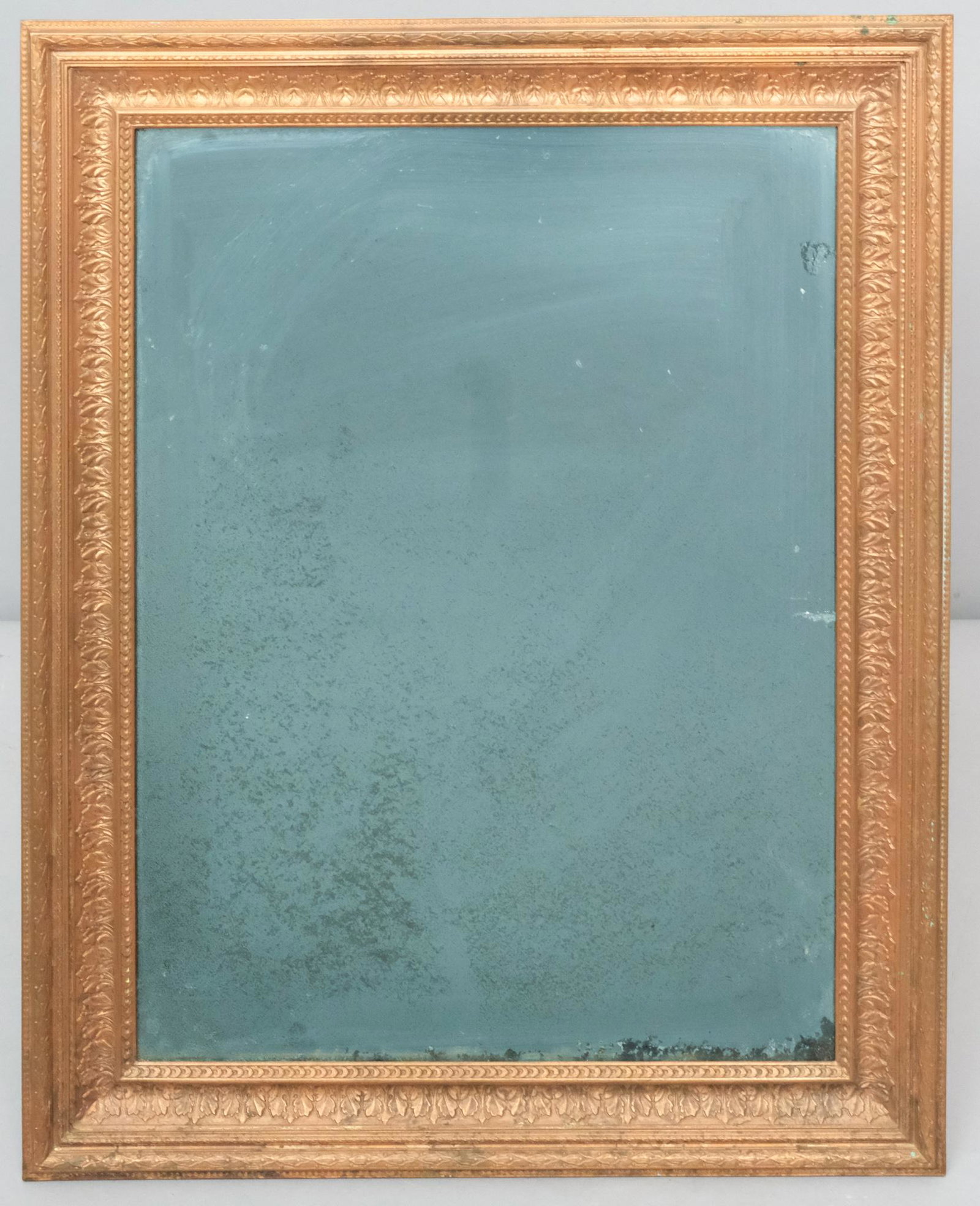 French Empire Gilt Brass Frame: French, 19th century, currently with antique distressed mirror plate. Rabbet: 9" x 12" Overall: 11 1/2" X 14 1/2".