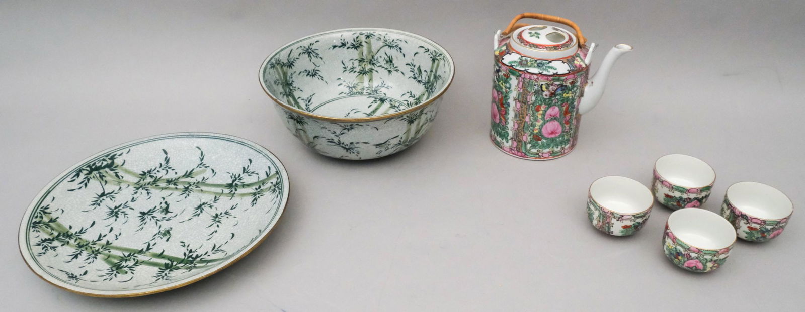 Rose Medallion Teapot & Set of 4 Cups: Together with a crackle glaze bowl and underplate, decorated with bamboo. Marked as shown. Teapot 8 1/2" tall, the bowl 10 5/8" in diameter.