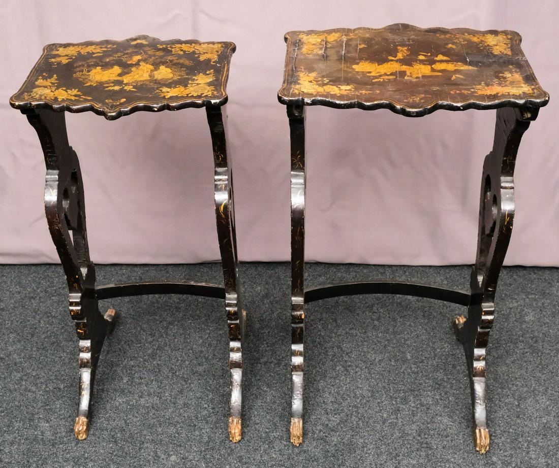 Antique Chinese Black Lacquer Nesting Tables: Delicately decorated in gold with floral corner motif. Two graduated tables with carved lion feet. Measuring: Larger table 14" x 13 1/4" x 26"