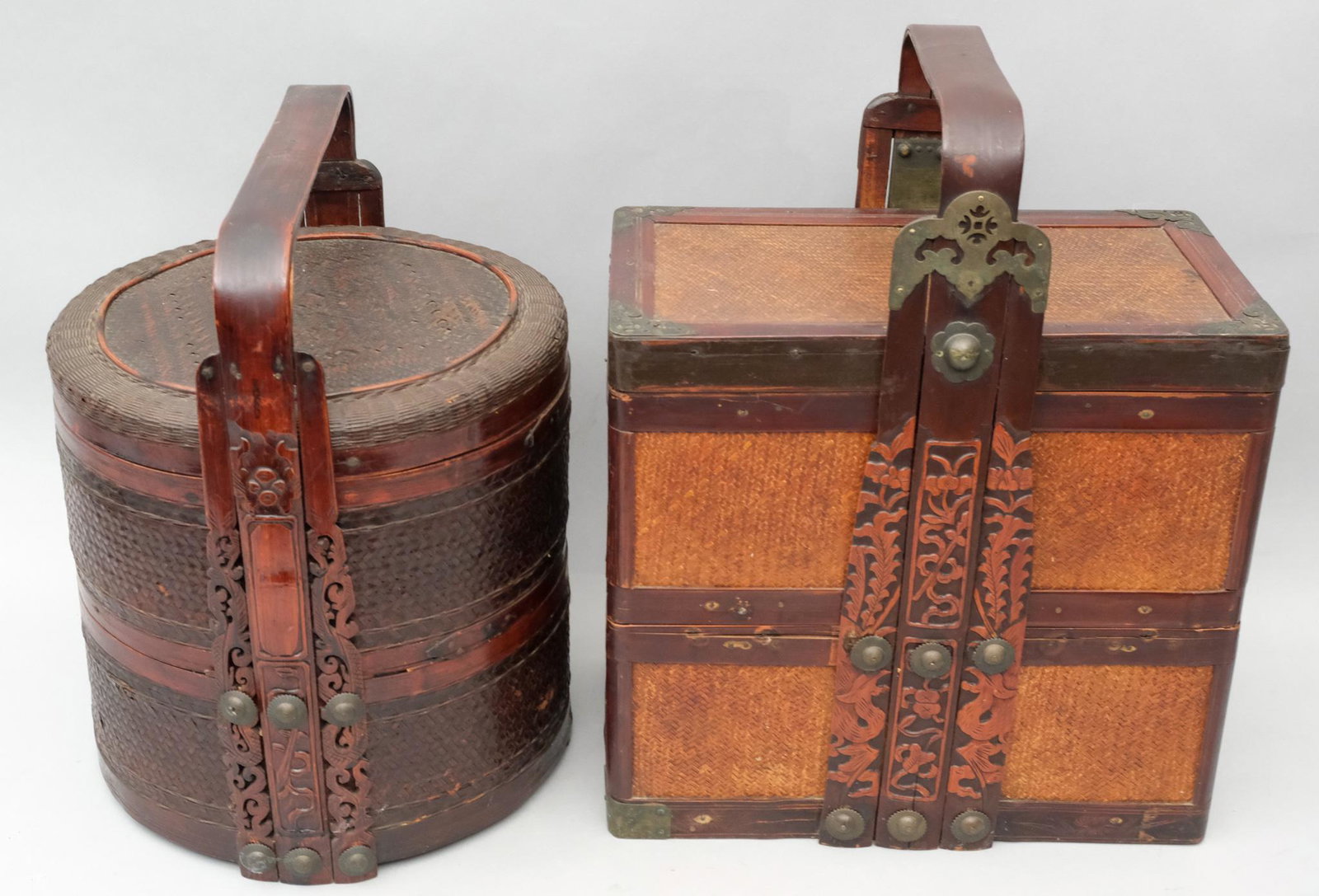 2 Chinese Woven Wicker Wedding Boxes: One of cylindrical form, with carved handle, the other rectangular with brass elements. 15 1/2" and 17 1/2".