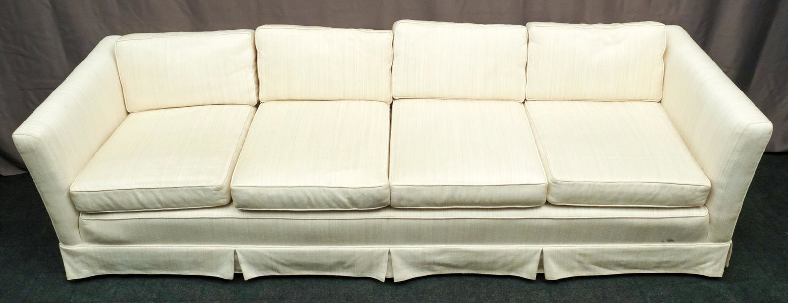 Four Cushion Extra-Long Couch: Featuring lovely cream colored stripes and a generous four cushion design. Measures 98" L X 33" D X 25 1/2" H.