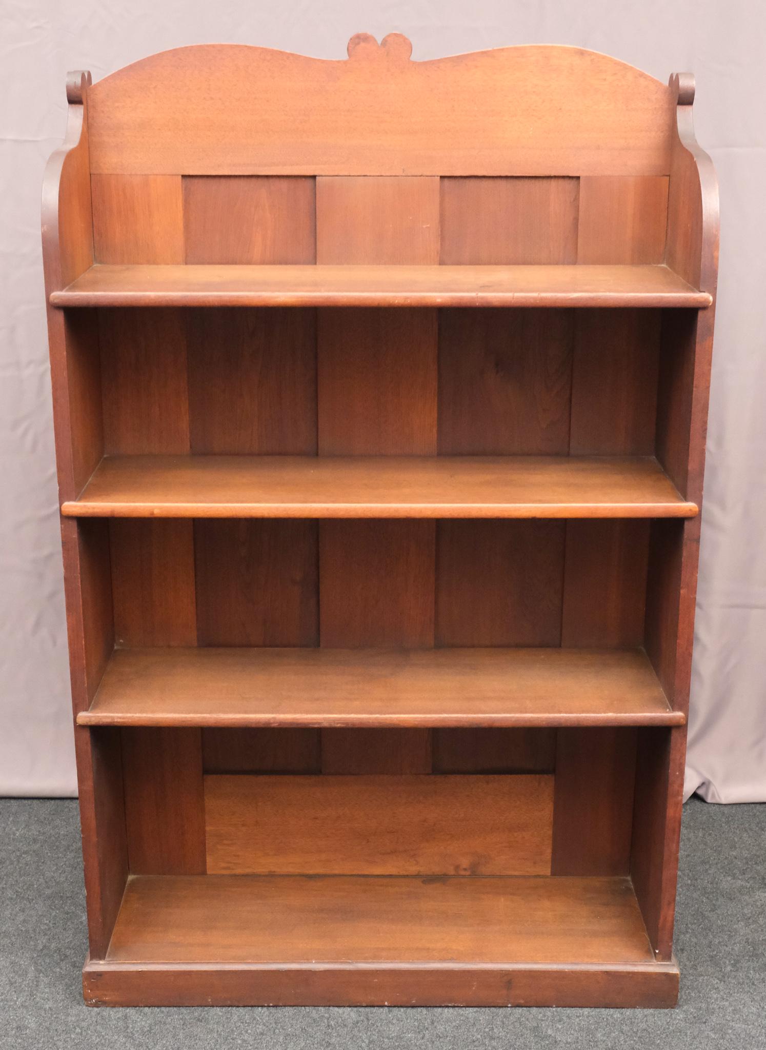 Antique Dual Facing Arts & Crafts Bookshelf: Sturdily constructed, four shelves on either side terminating in hearts at center and sides. 21" deep X 36" length X 57" high