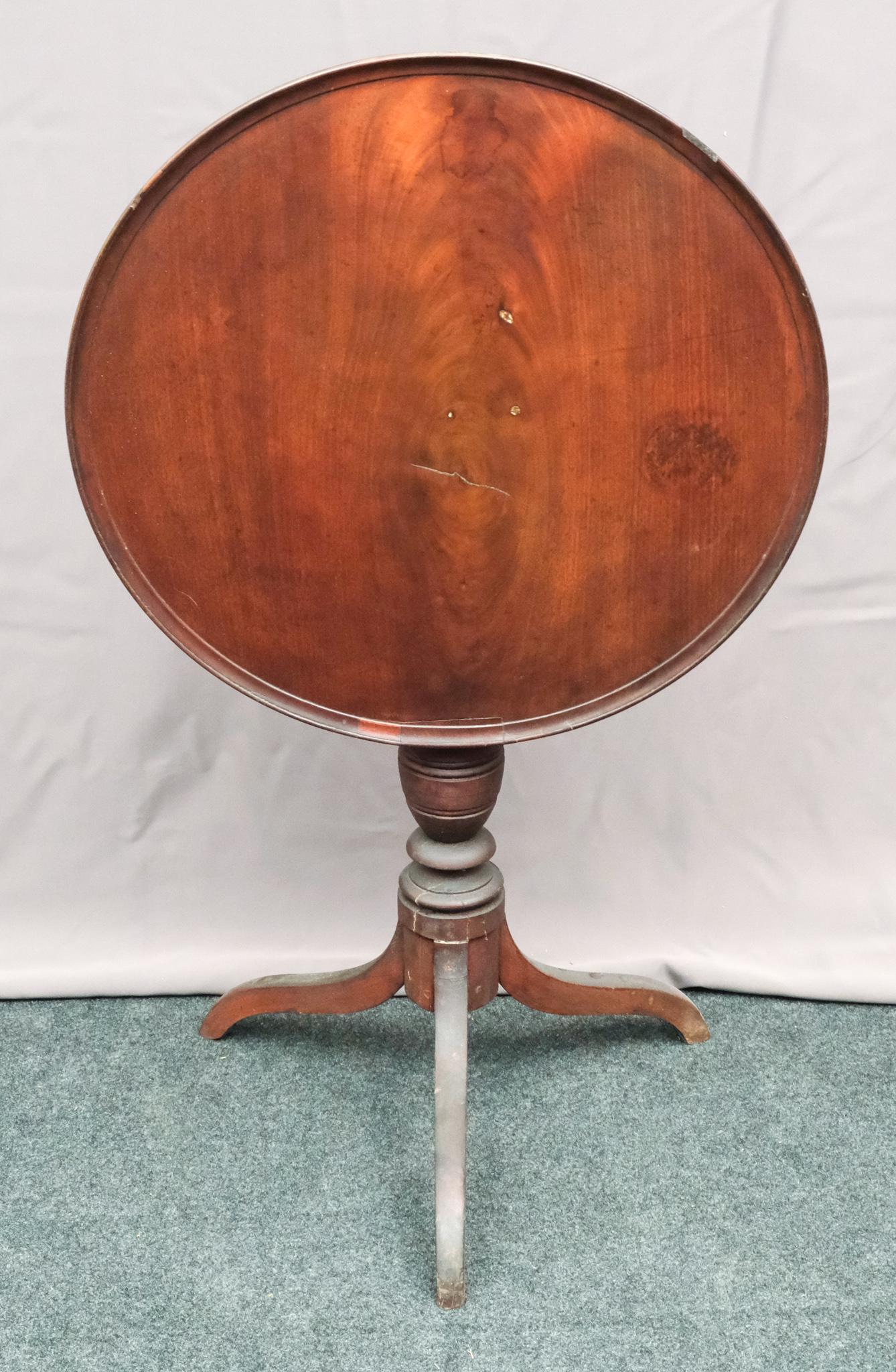 Antique Mahogany Pie Crust Candle Stand: Tri-foot dovetailed construction construction with wide-foot base. Solid wood top. Measures 23 3/4" diameter X 27 1/2" height.