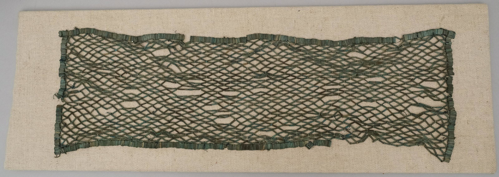Ancient Egyptian Faience Bead Pectoral Net: A wonderful Egyptian beaded pectoral net, Late Period, c. 664 - 332 BC, of long, rectangular form, comprised primarily of colorful faience tubular beads. Beautiful work and rare to find so complete. S